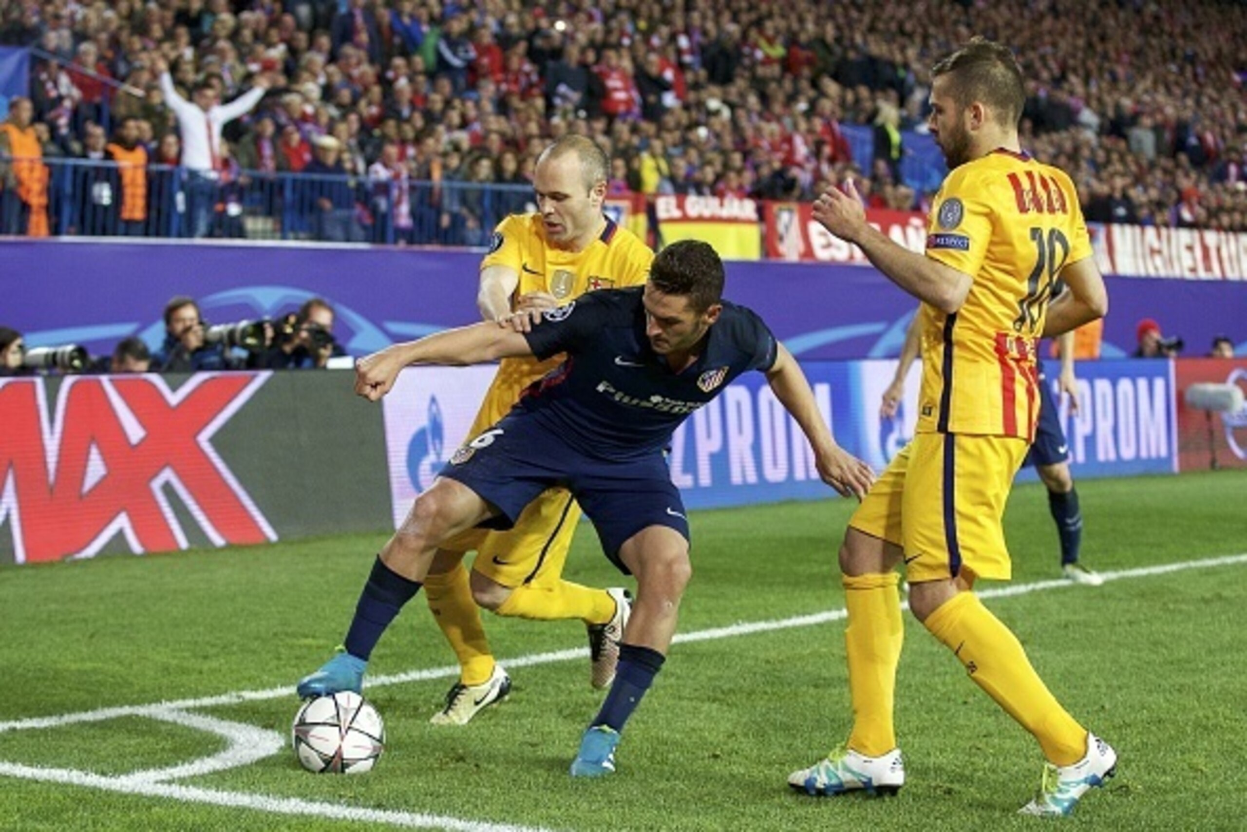(L-R) Andres Iniesta of FC Barcelona, Koke of Club Atletico de Madrid, Jordi Alba of FC Barcelona during the UEFA Champions League quarter-final match between  Atletico Madrid and FC Barcelona on April 13, 2016 at the Vicente Calderon stadium in Madrid, S