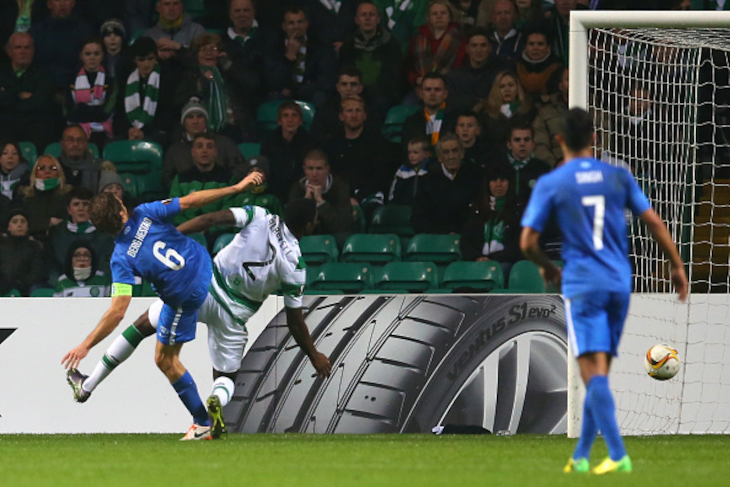 GLASGOW, SCOTLAND - NOVEMBER 05:  Daniel Berg Hestad of Molde scores his team's second goal despite the challenge from Tyler Blackett of Celtic during the UEFA Europa League Group A match between Celtic FC and Molde FK at Celtic Park on November 5, 2015 i