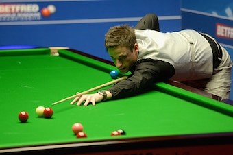SHEFFIELD, ENGLAND - APRIL 17:  David Gilbert plays a shot against Ronnie O'Sullivan during their first round match of the 2016 Betfred World Snooker Championship at Crucible Theatre on April 17, 2016 in Sheffield, England.  (Photo by Gareth Copley/Getty 