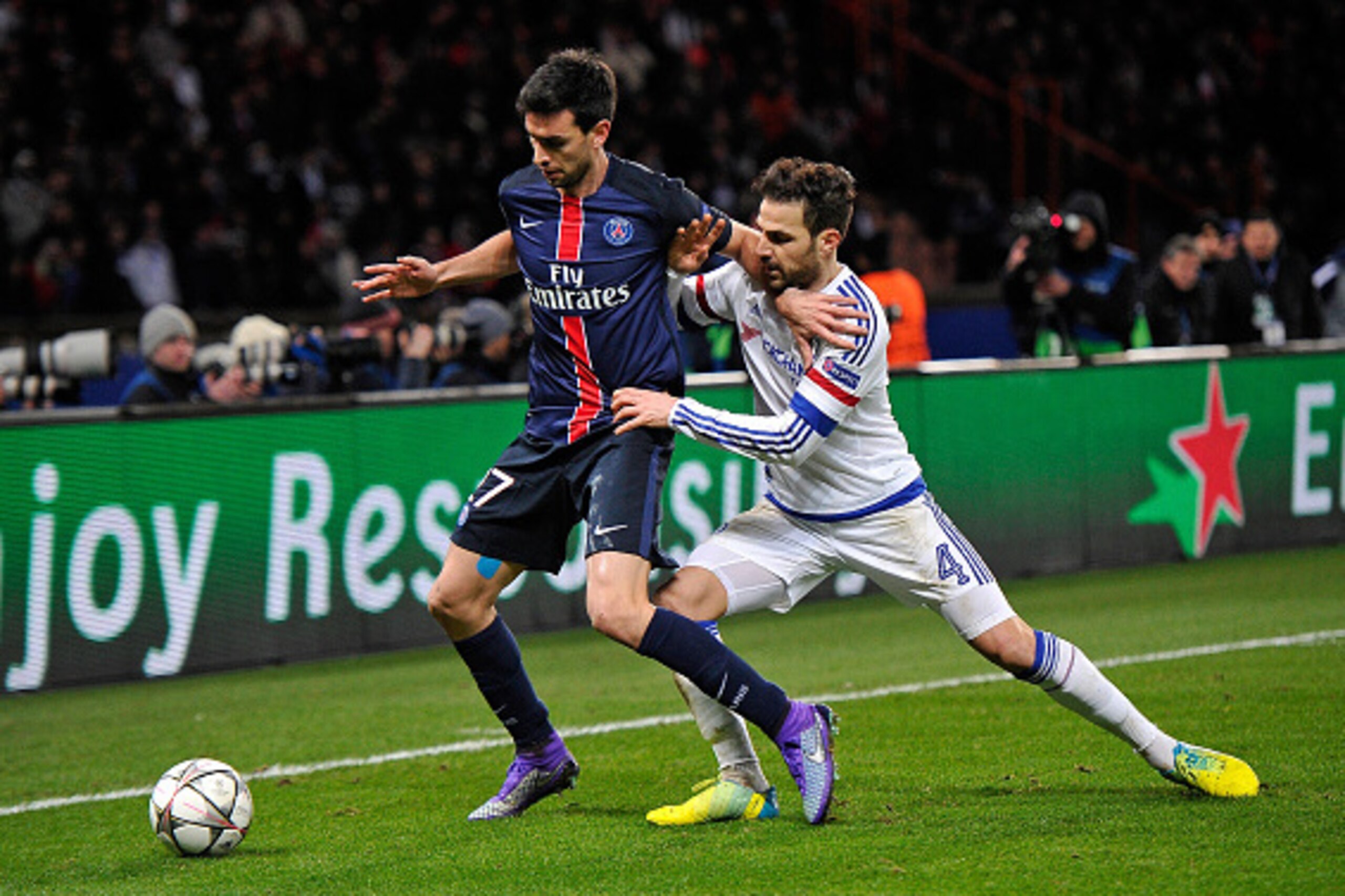 PARIS, FRANCE - FEBRUARY 16:  Javier Pastore of Paris Saint-Germain and Cesc Fabregas of Chelsea FC fight for the ball during the Champion's League game between Paris Saint-Germain and Chelsea FC on February 16, 2016 in Paris, France.  (Photo by Aurelien 