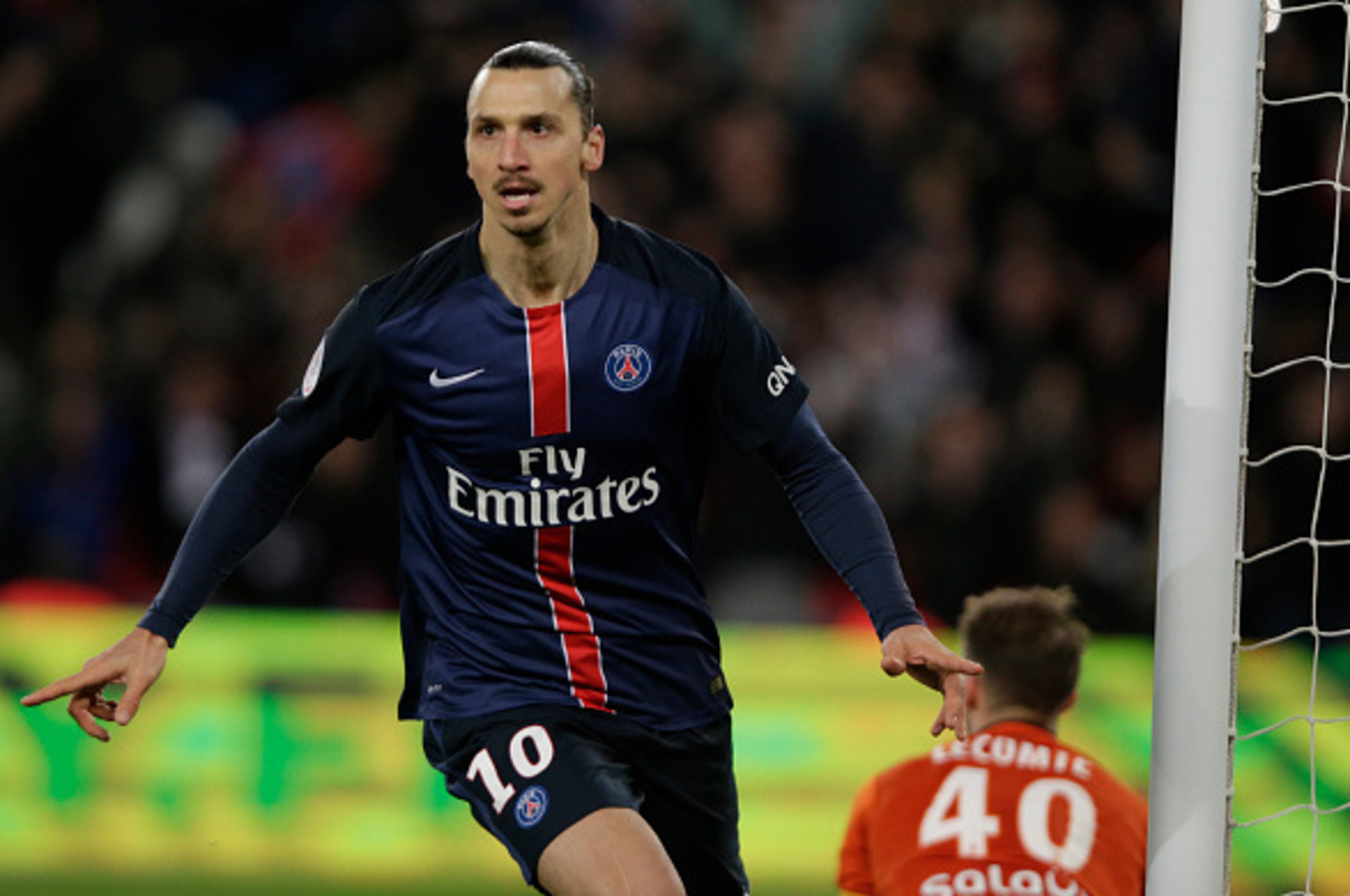 Paris Saint-Germain's Swedish forward Zlatan Ibrahimovic celebrates after scoring a goal during the French L1 football match between Paris Saint-Germain (PSG) vs FC Lorient on February 03, 2016 at the Parc des Princes stadium in Paris. / AFP / KENZO TRIBO