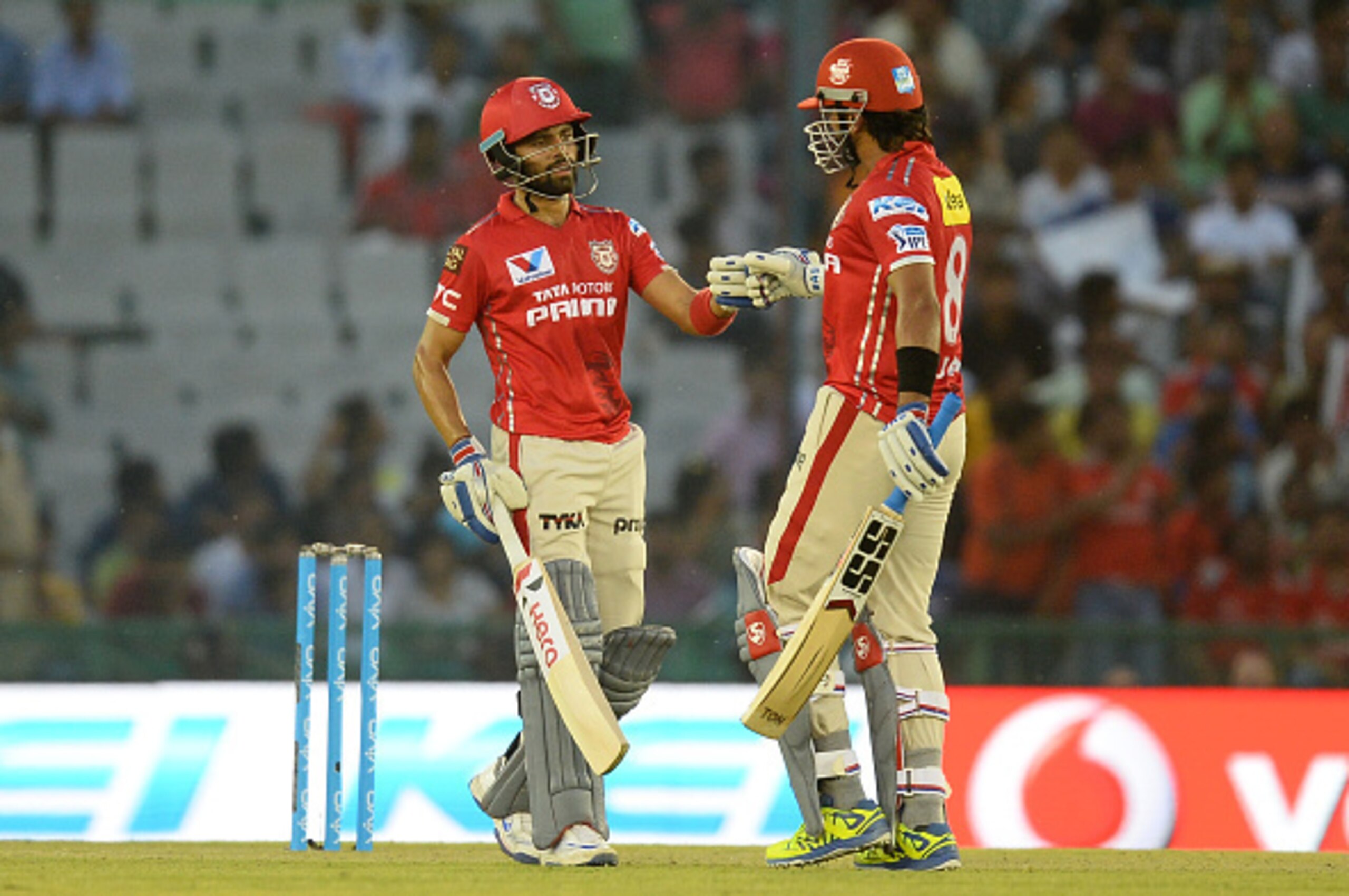 Kings XI Punjab batsman Manan Vohra (L) celebrates his 50 runs half century with teammate  Murali Vijay during the 2016 Indian Premier League (IPL) Twenty20 cricket match between Rising Pune Supergiants and Kings XI Punjab at The Punjab Cricket Associatio