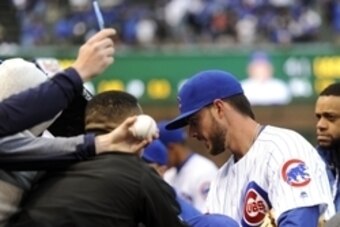 Apr 13, 2016; Chicago, IL, USA; Chicago Cubs third baseman Kris Bryant (17)   signs autographs before the game against the Cincinnati Reds at Wrigley Field. Mandatory Credit: Matt Marton-USA TODAY Sports