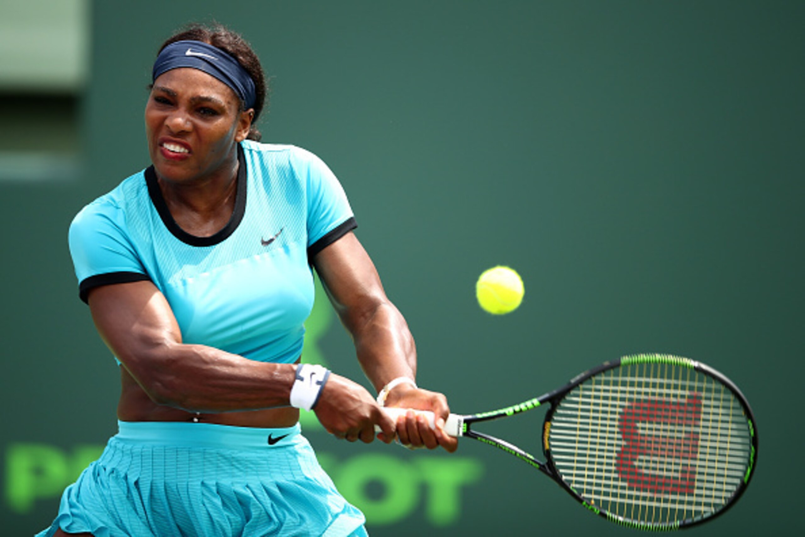KEY BISCAYNE, FL - MARCH 28:  Serena Williams of the United States plays a backhand against Svetlana Kuznetsova of Russia in their fourth round match during the Miami Open Presented by Itau at Crandon Park Tennis Center on March 28, 2016 in Key Biscayne, 