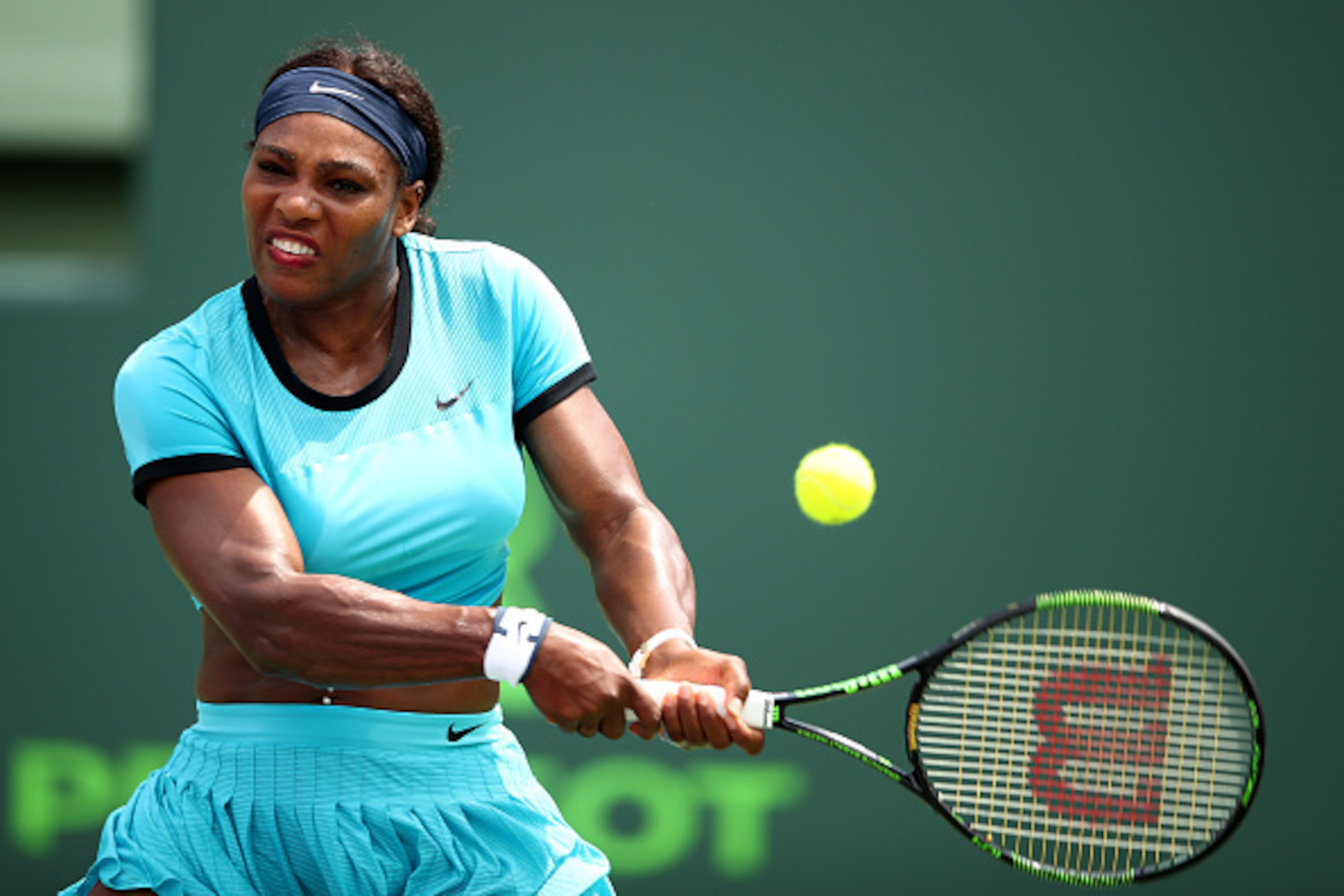 KEY BISCAYNE, FL - MARCH 28:  Serena Williams of the United States plays a backhand against Svetlana Kuznetsova of Russia in their fourth round match during the Miami Open Presented by Itau at Crandon Park Tennis Center on March 28, 2016 in Key Biscayne, 