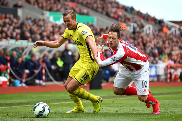 STOKE ON TRENT, ENGLAND - MAY 09:  Harry Kane of Tottenham Hotspur is challenged by Marko Arnautovic of Stoke City during the Barclays Premier League match between Stoke City and Tottenham Hotspur at Britannia Stadium on May 9, 2015 in Stoke on Trent, Eng