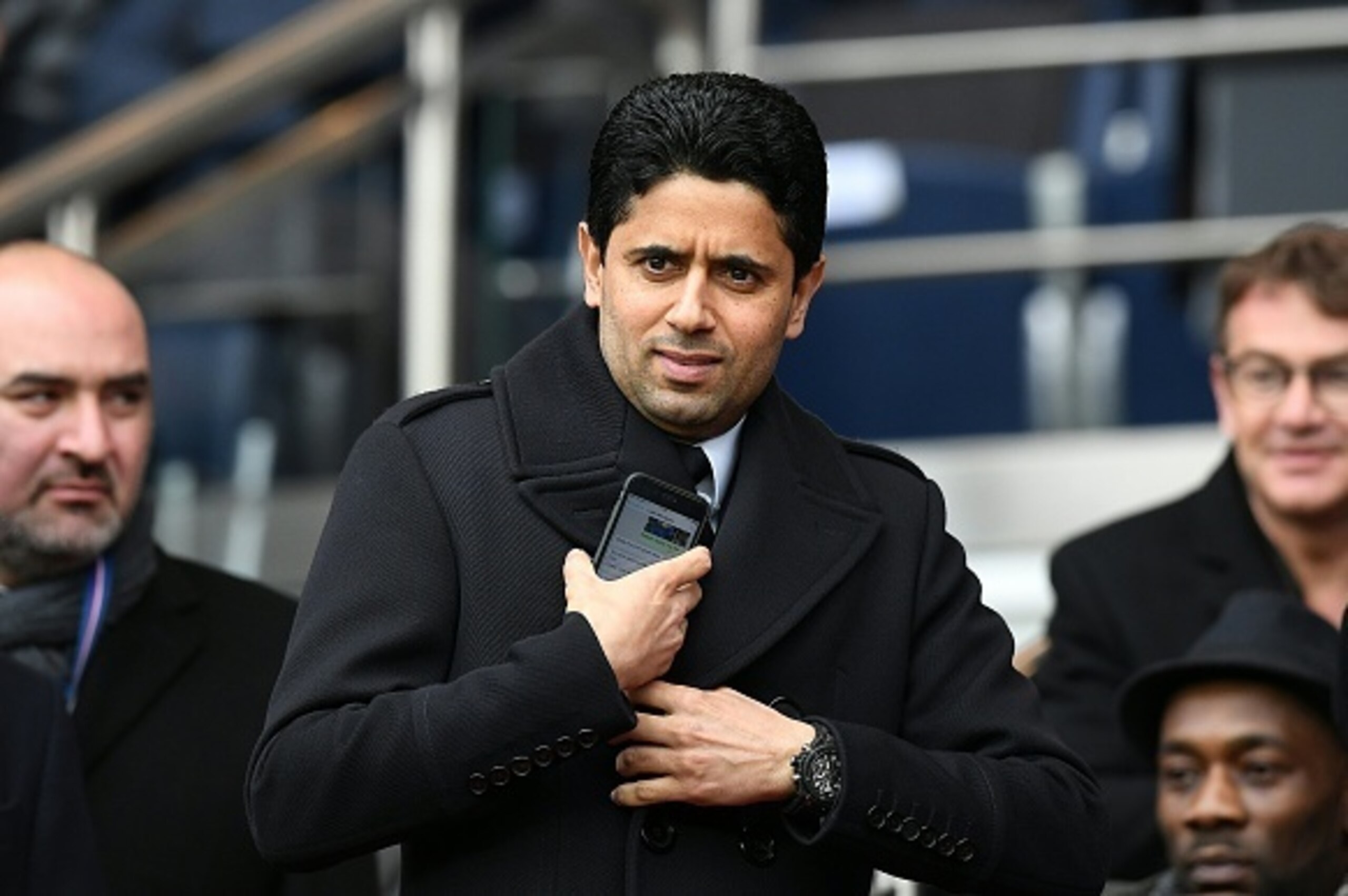Paris Saint-Germain's Qatari president Nasser Al-Khelaifi (C) attends the French L1 football match between Paris Saint-Germain and Nice at the Parc des Princes stadium in Paris on April 2, 2016.   / AFP / FRANCK FIFE        (Photo credit should read FRANC