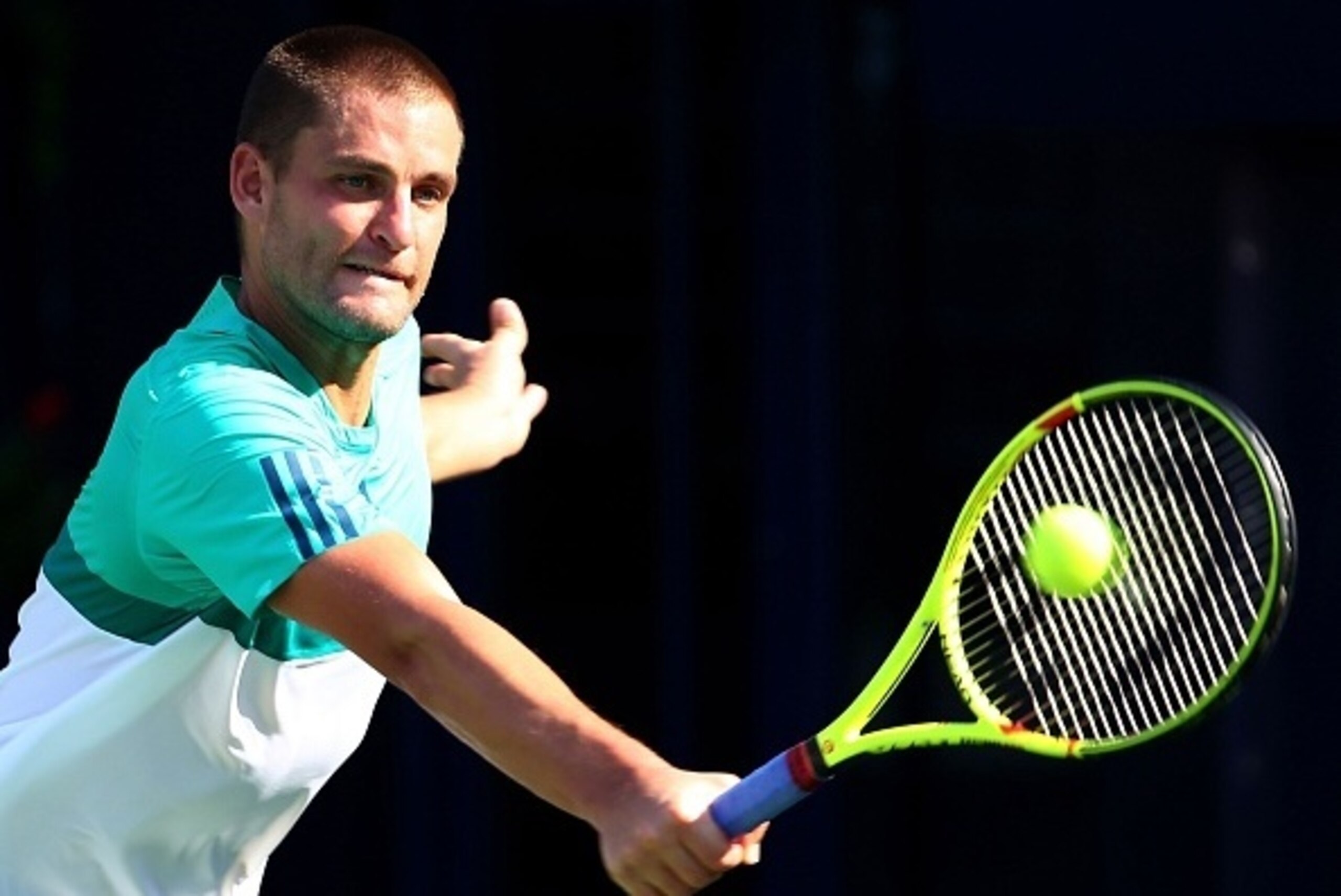 Russian Mikhail Youzhny returns the ball to Tunisian Malek Jaziri during their ATP tennis match on the first round of the Dubai Duty Free Tennis Championships on February 22, 2016.       / AFP / MARWAN NAAMANI        (Photo credit should read MARWAN NAAMA