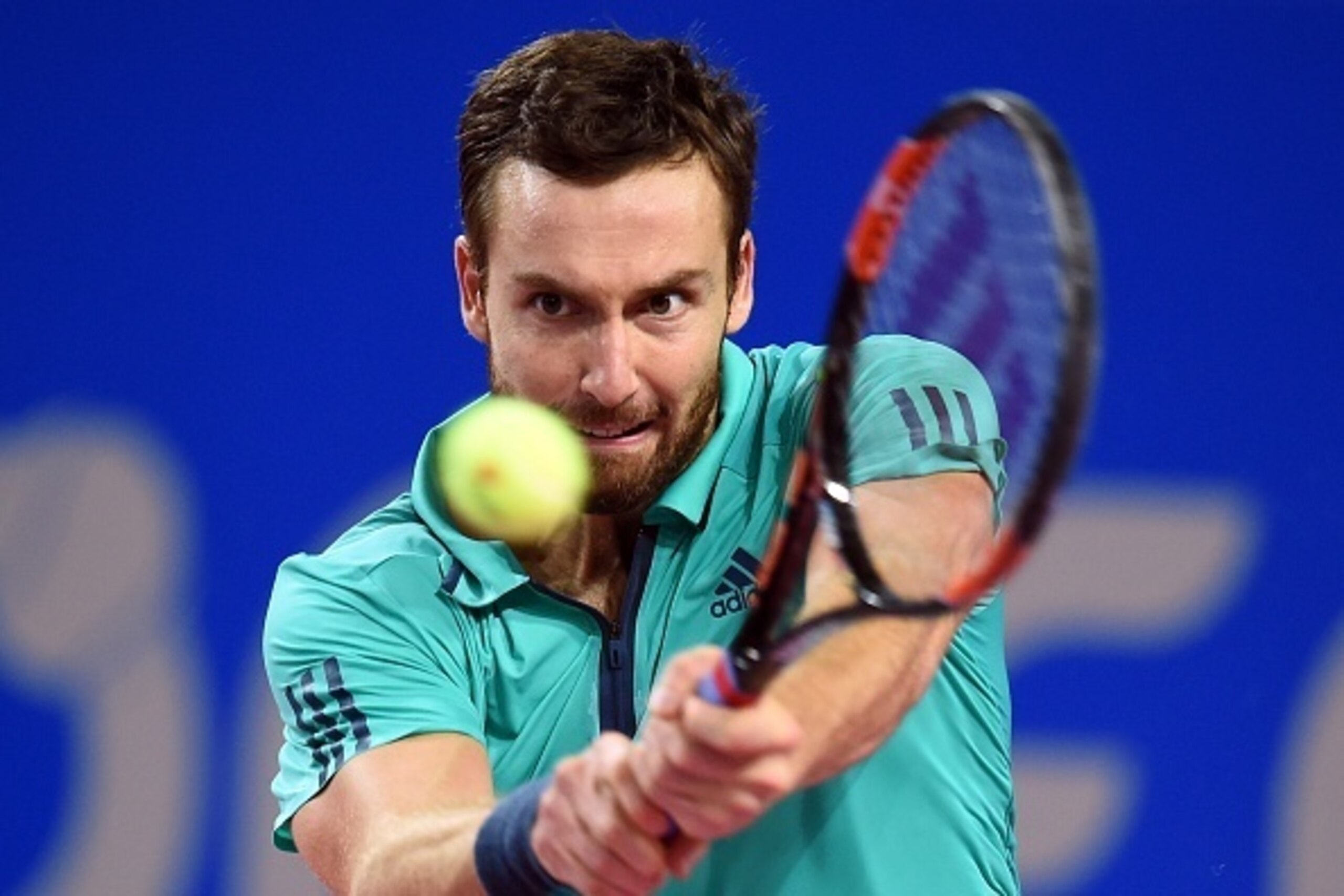Latvian player Ernest Gulbis returns the ball to French player Richard Gasquet during their tennis match at the Open Sud de France ATP World Tour in Montpellier, southern France, on February 3, 2016. / AFP / PASCAL GUYOT        (Photo credit should read P