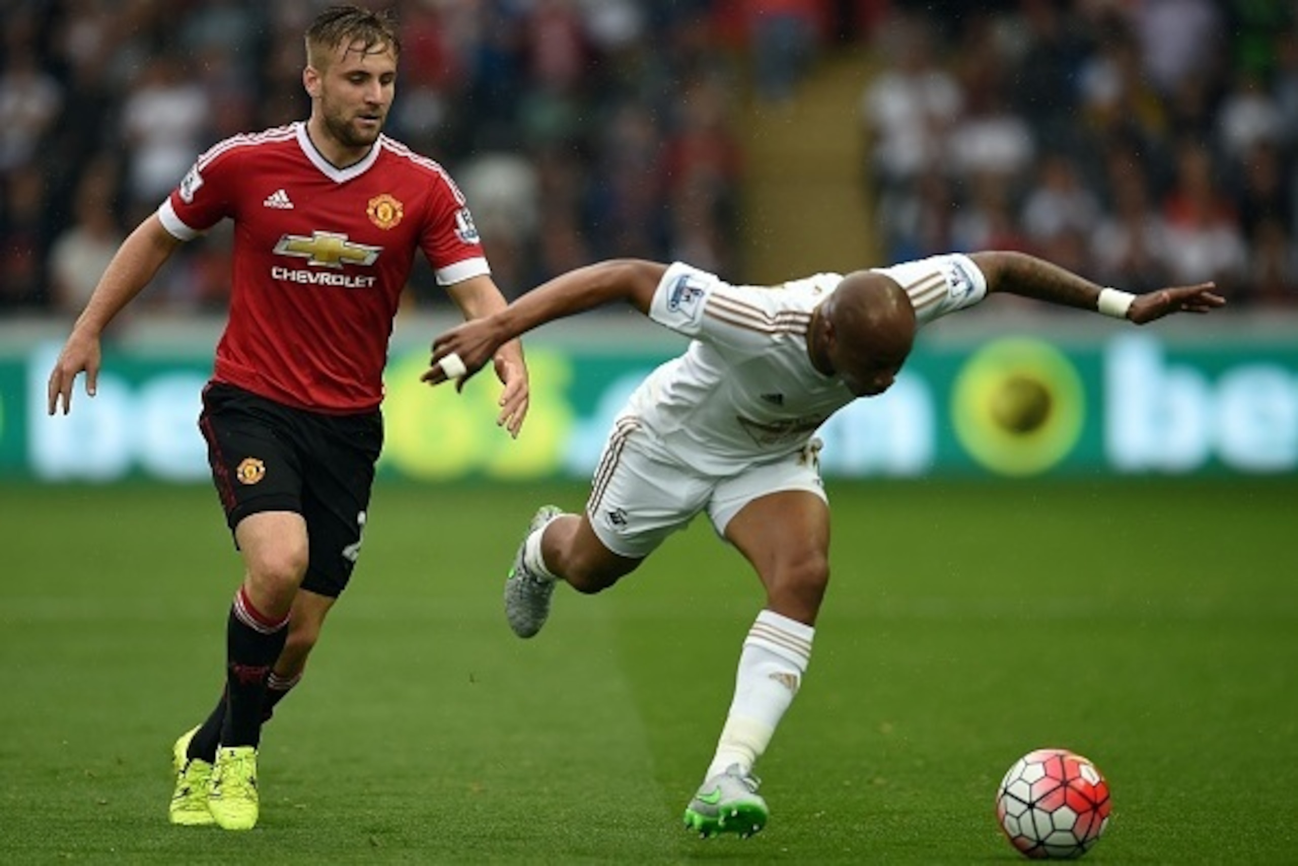 Manchester United's English defender Luke Shaw (L) vies with Swansea City's Ghanaian striker Andre Ayew during the English Premier League football match between Swansea City and Manchester United at The Liberty Stadium in Swansea, south Wales on August 30 Manchester United's English defender Luke Shaw (L) vies with Swansea City's Ghanaian striker Andre Ayew during the English Premier League football match between Swansea City and Manchester United at The Liberty Stadium in Swansea, south Wales on August 30