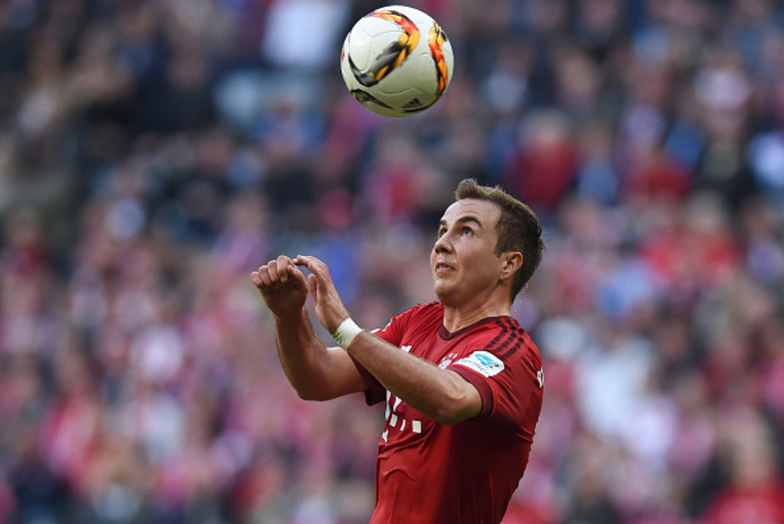 Bayern Munich's midfielder Mario Goetze heads the ball during the German first division Bundesliga football match FC Bayern Munich vs Schalke 04 in Munich, southern Germany, on April 16, 2016.
Bayern Munich won the match 3-0. / AFP / CHRISTOF STACHE / RES