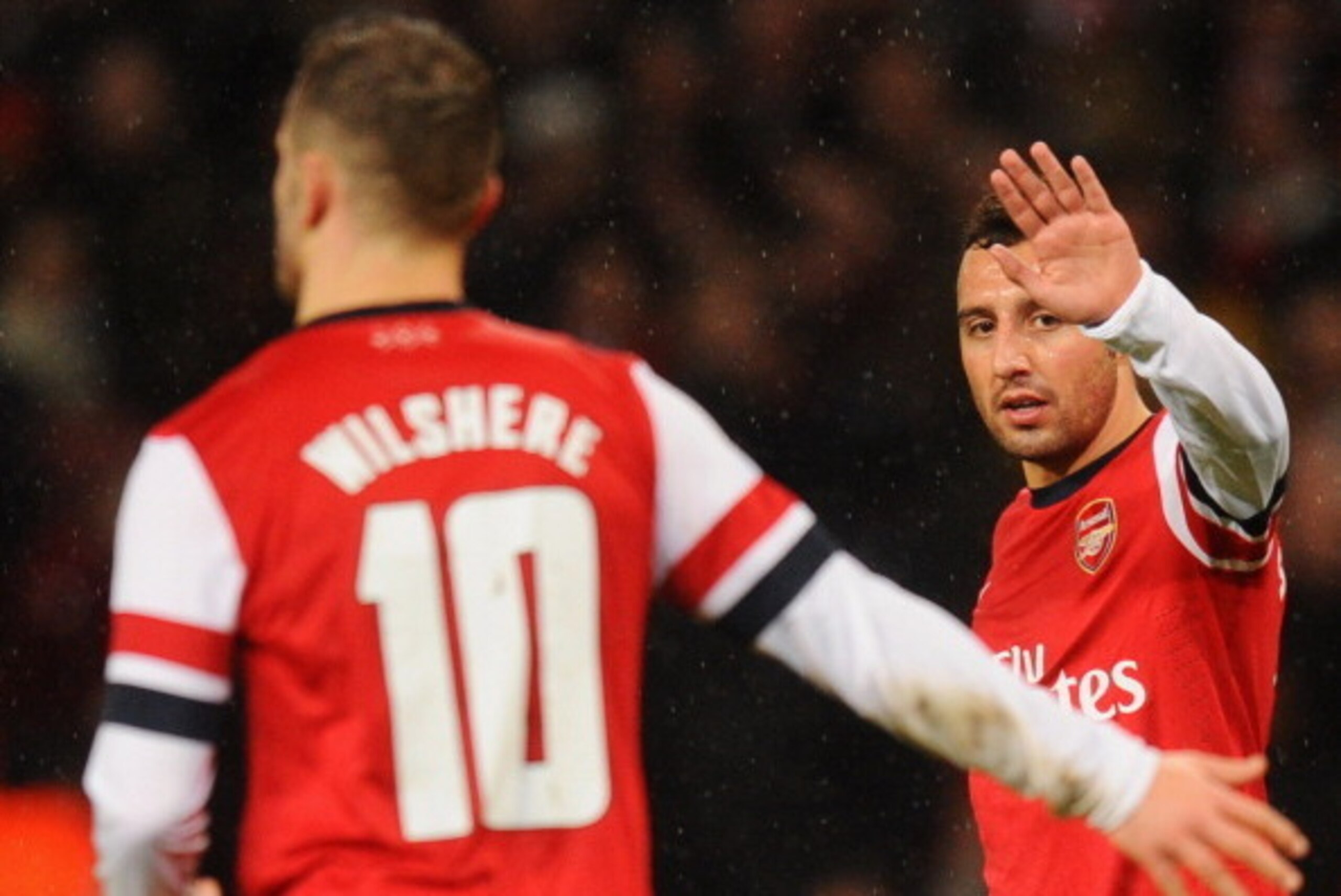 LONDON, ENGLAND - JANUARY 24:  Santi Cazorla of Arsenal (R) celebrates with Jack Wilshere of Arsenal as he scores their fourht goal during the FA Cup with Budweiser Fourth round match between Arsenal and Coventry City at Emirates Stadium on January 24, 20