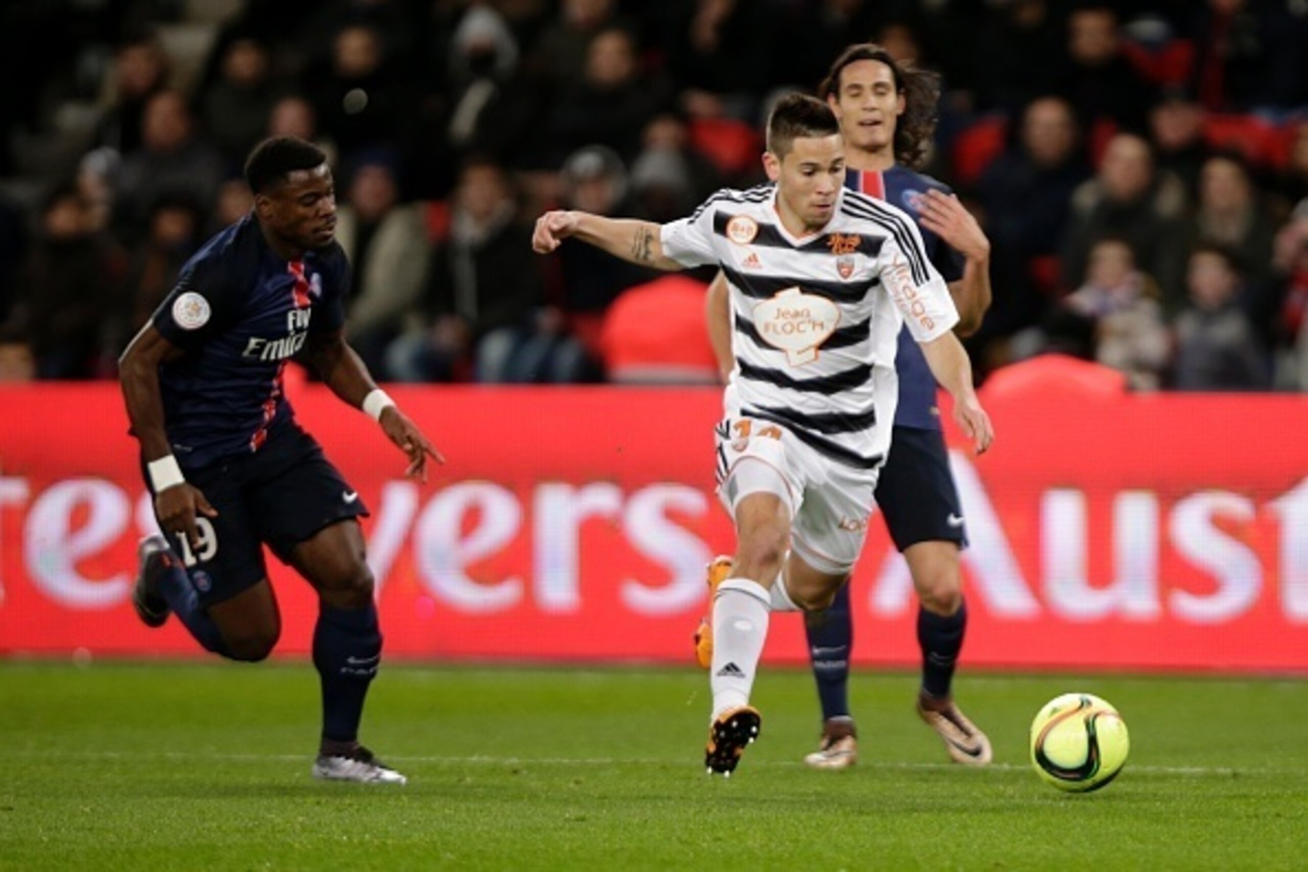 Lorient's French defender Raphael Guerreiro scores a goal during the French L1 football match between Paris Saint-Germain (PSG) and Lorient on February 3, 2016 at the Parc des Princes stadium in Paris. / AFP / KENZO TRIBOUILLARD        (Photo credit shoul