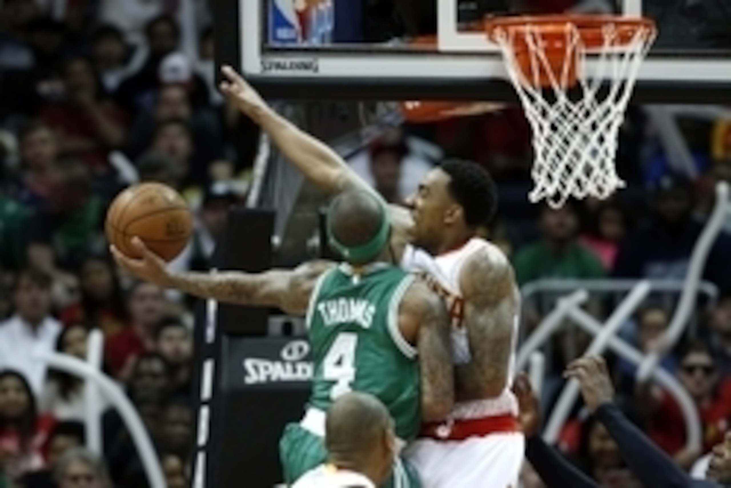 Apr 19, 2016; Atlanta, GA, USA; Boston Celtics guard Isaiah Thomas (4) attempts a shot against Atlanta Hawks guard Jeff Teague (0) in the third quarter of game two of the first round of the NBA Playoffs at Philips Arena. Mandatory Credit: Jason Getz-USA T