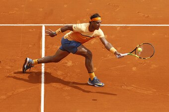TOPSHOT - Spain's Rafael Nadal returns the ball to France's Gael Monfils during the final tennis match at the Monte-Carlo ATP Masters Series Tournament in Monaco on April 17, 2016.  AFP PHOTO / VALERY HACHE / AFP / VALERY HACHE        (Photo credit should