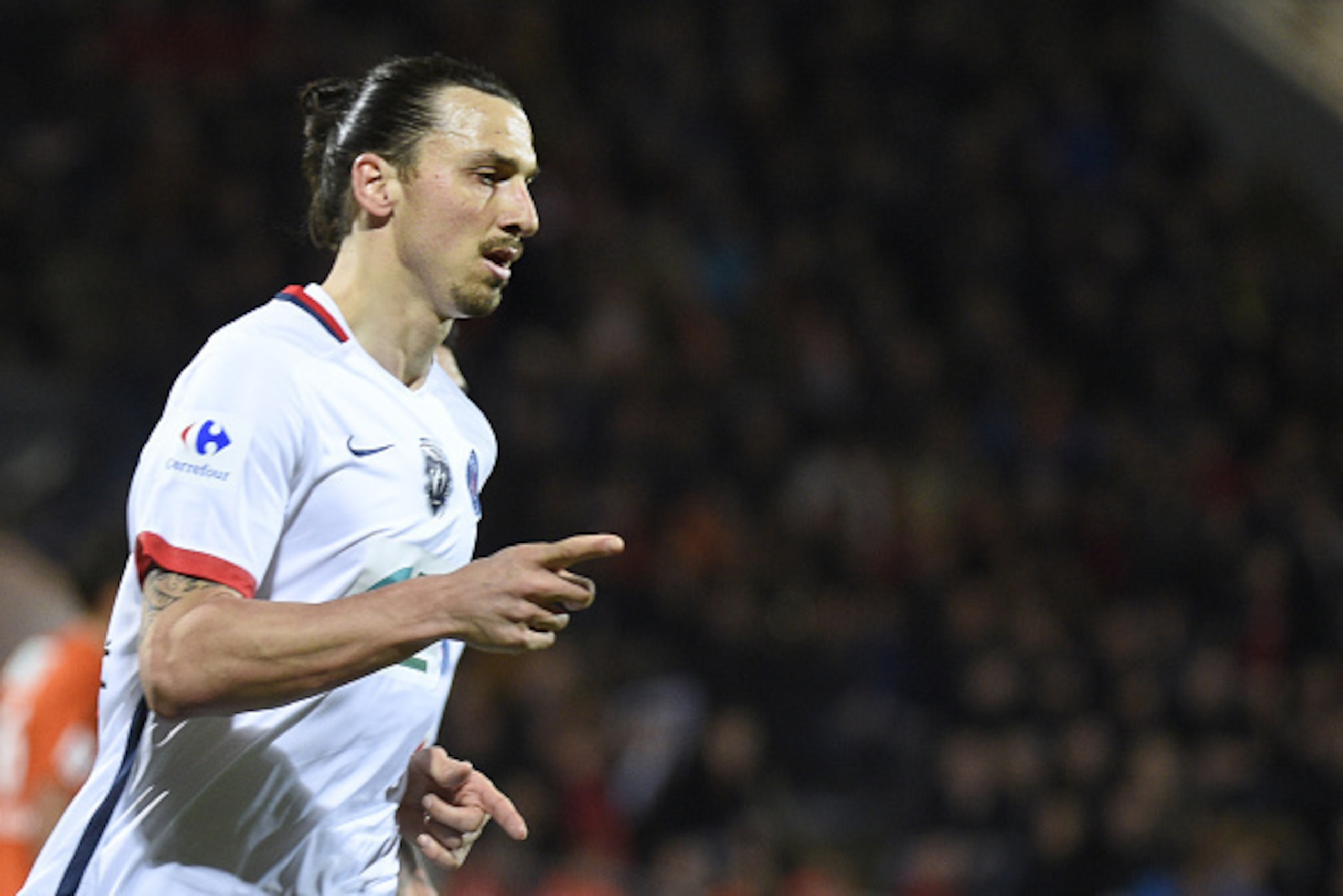 Paris Saint-Germain's Swedish forward Zlatan Ibrahimovic celebrates after scoring a goal during the French Cup semi-final football match between Lorient (FCL) and Paris Saint-Germain (PSG) at Moustoir stadium in Lorient, western France, on April 19, 2016.