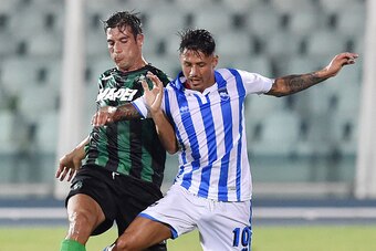 PESCARA, ITALY - AUGUST 02:  Federico Peluso of Sassuolo and Gianluca Lapadula of Pescara in action during the preseason friendly match between Pescara Calcio and US Sassuolo Calcio at Adriatico Stadium on August 2, 2015 in Pescara, Italy.  (Photo by Gius