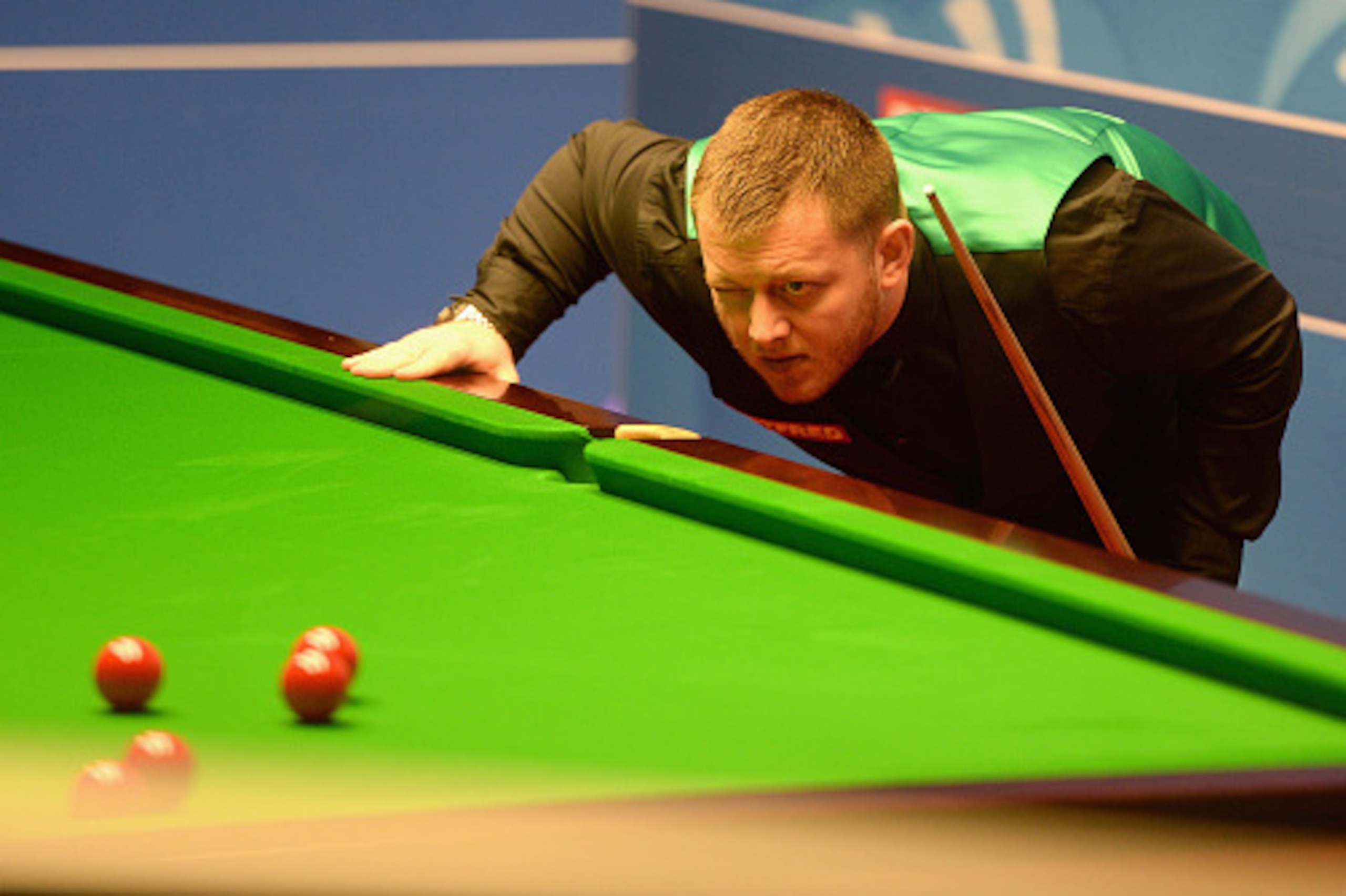 SHEFFIELD, ENGLAND - APRIL 19:  Mark Allen lines up a shot against Mitchell Mann during their first round match of the World Snooker Championship at Crucible Theatre on April 19, 2016 in Sheffield, England.  (Photo by Gareth Copley/Getty Images)