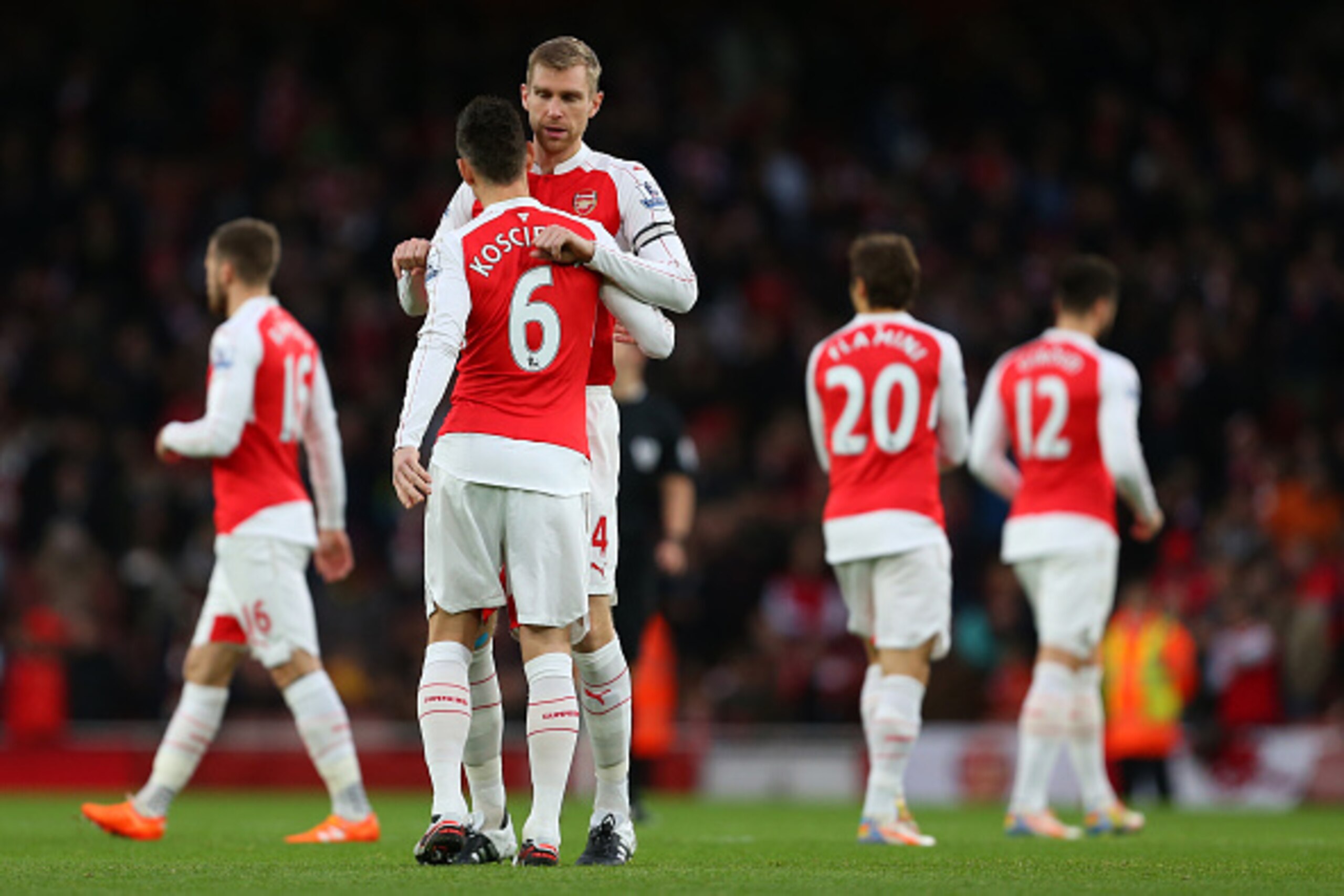 LONDON, ENGLAND - DECEMBER 05:  Per Mertesacker of Arsenal hugs Laurent Koscielny of Arsenal during the Barclays Premier League match between Arsenal and Sunderland at the Emirates Stadium on December 05, 2015 in London, England.  (Photo by Catherine Ivil