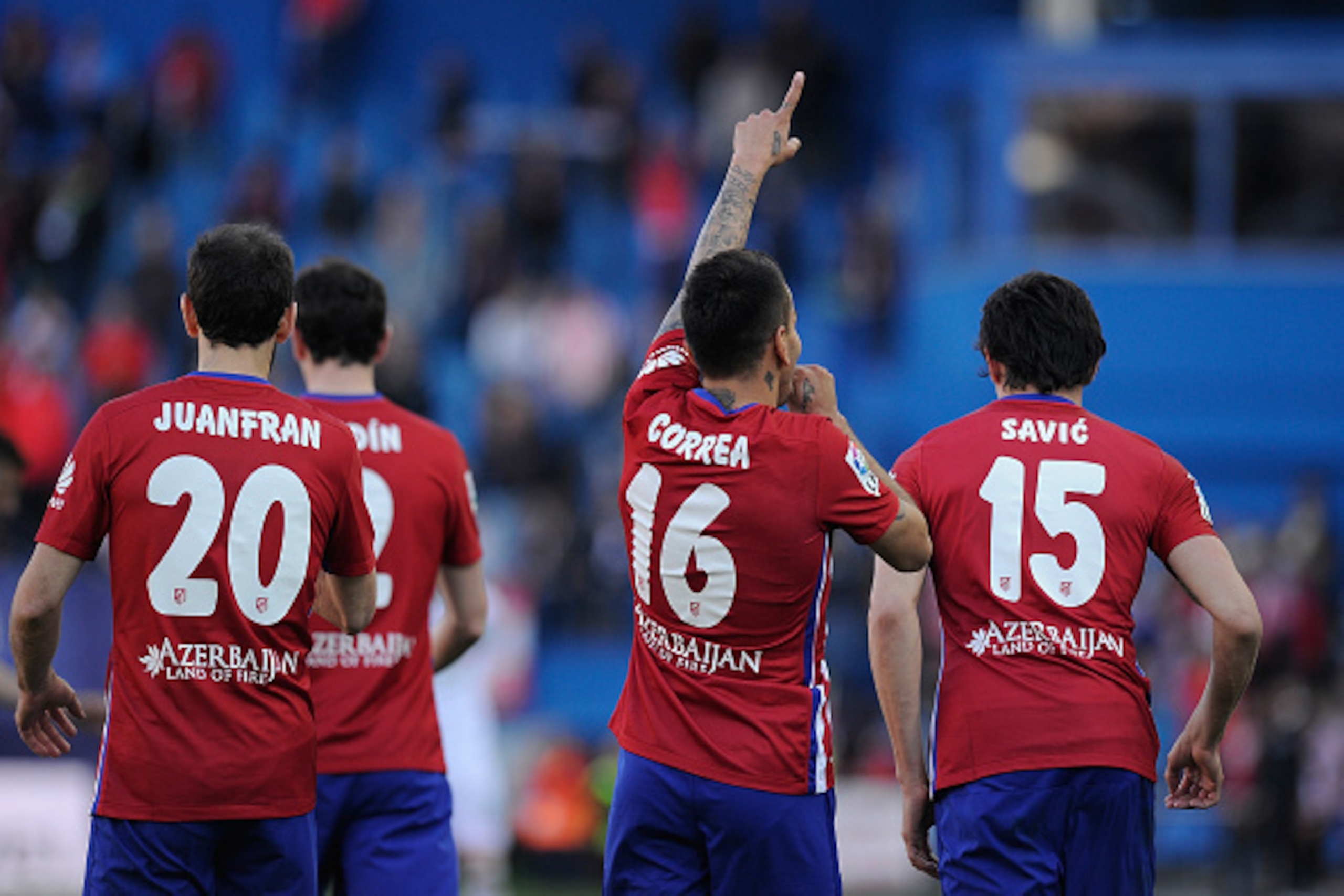 MADRID, SPAIN - APRIL 17:  Angel Correa of Club Atletico de Madrid celebrates with teammates after scoring his team's 3rd goal during the La Liga match between Club Atletico de Madrid and Granada CF at Vicente Calderon Stadium on April 17, 2016 in Madrid,