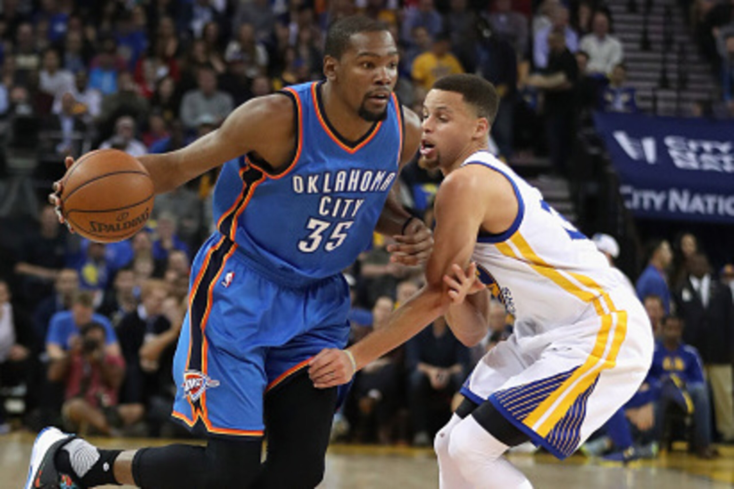 OAKLAND, CA - MARCH 03:  Kevin Durant #35 of the Oklahoma City Thunder tries to dribble past Stephen Curry #30 of the Golden State Warriors at ORACLE Arena on March 3, 2016 in Oakland, California.  NOTE TO USER: User expressly acknowledges and agrees that