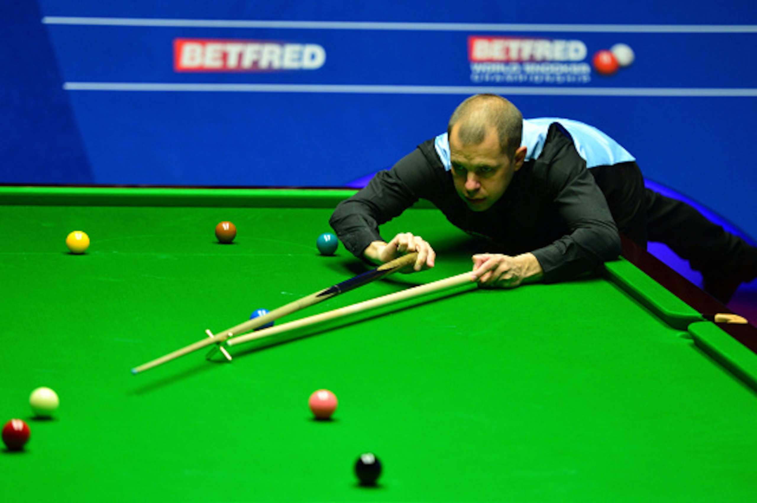 SHEFFIELD, ENGLAND - APRIL 20:  Barry Hawkins of England plays a shot during his first round match against Zhang Anda of China on day 5 of the World Snooker Championship at The Crucible Theatre on April 20, 2016 in Sheffield, England.  (Photo by Dan Mulla