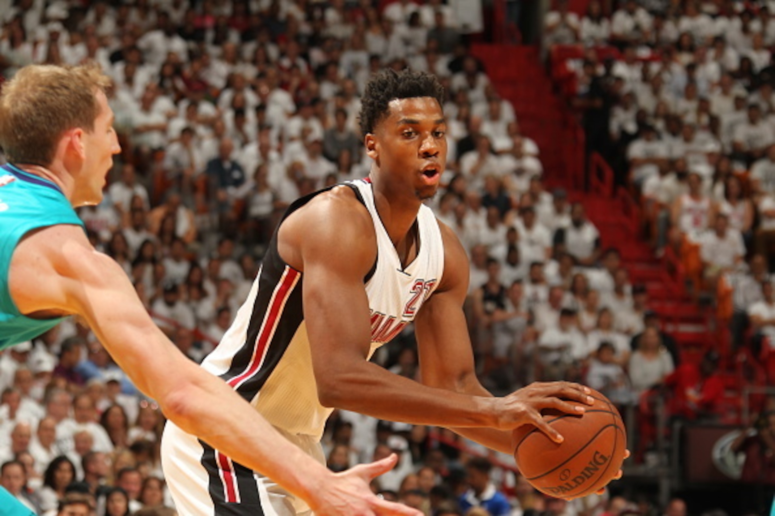 MIAMI, FL - APRIL 17: Hassan Whiteside #21 of the Miami Heat moves the ball against the Charlotte Hornets during Game One of the Eastern Conference Quarterfinals of the 2016 NBA Playoffs on April 17, 2016 at American Airlines Arena in Miami, Florida. NOT MIAMI, FL - APRIL 17: Hassan Whiteside #21 of the Miami Heat moves the ball against the Charlotte Hornets during Game One of the Eastern Conference Quarterfinals of the 2016 NBA Playoffs on April 17, 2016 at American Airlines Arena in Miami, Florida. NOT