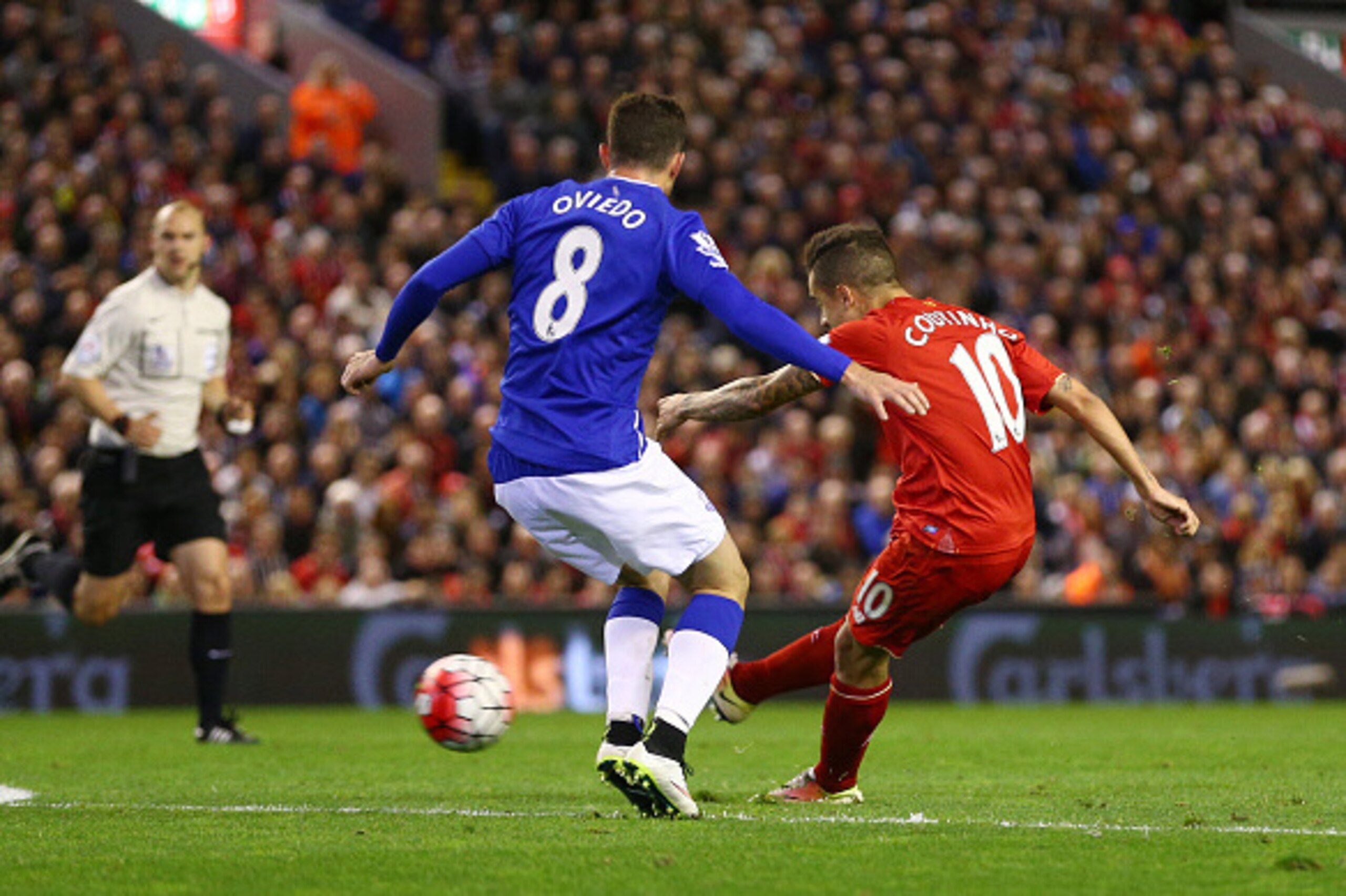 LIVERPOOL, ENGLAND - APRIL 20:  Philippe Coutinho of Liverpool scores his sides fourth goal during the Barclays Premier League match between Liverpool and Everton at Anfield, April 20, 2016, Liverpool, England  (Photo by Clive Brunskill/Getty Images)