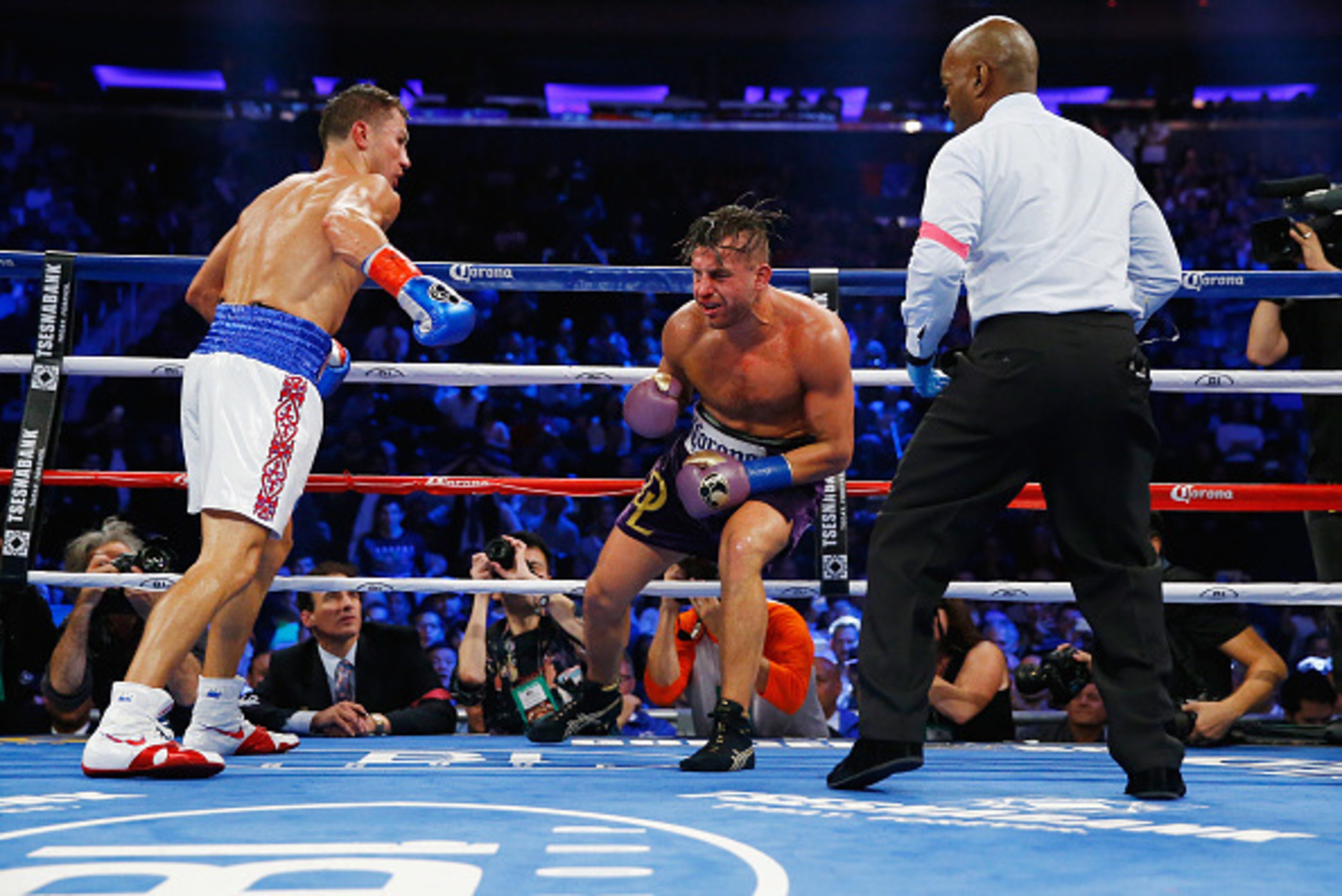 NEW YORK, NY - OCTOBER 17:  Gennady Golovkin punches David Lemieux shortly before the eigth round tko stoppage during their WBA/WBC interim/IBF middleweight title unification bout at Madison Square Garden on October 17, 2015 in New York City.  (Photo by A