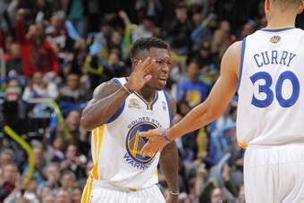 OAKLAND, CA - FEBRUARY 15: Nate Robinson #2 of the Golden State Warriors celebrates with teammate Stephen Curry #30 after making a shot against the Portland Trail Blazers on February 15, 2012 at Oracle Arena in Oakland, California. NOTE TO USER: User expr
