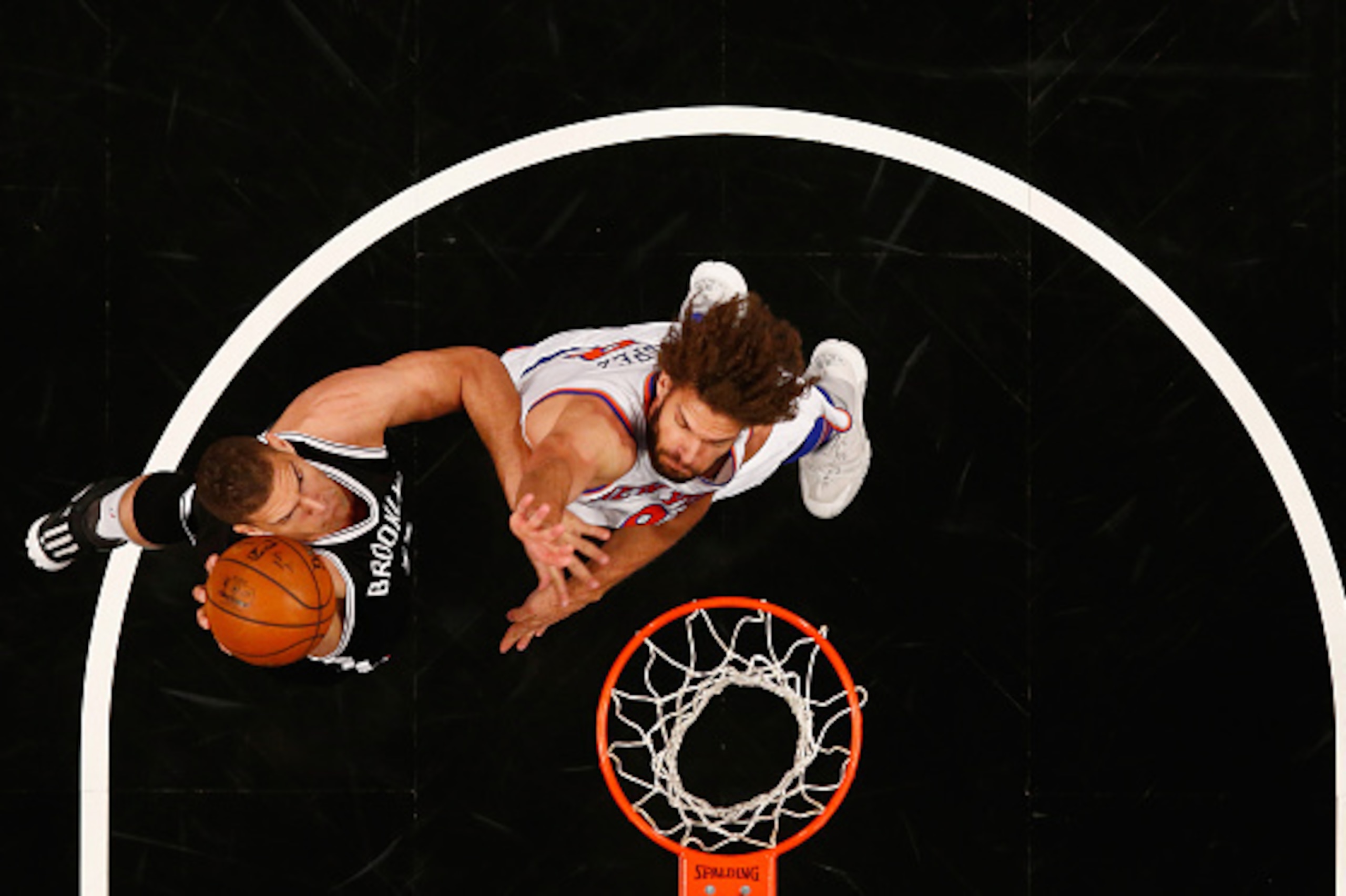 NEW YORK, NY - JANUARY 13:  Brook Lopez #11 of the Brooklyn Nets shoots against Robin Lopez #8 of the New York Knicks during their game at the Barclays Center on January 13, 2016 in New York City.  NOTE TO USER: User expressly acknowledges and agrees that