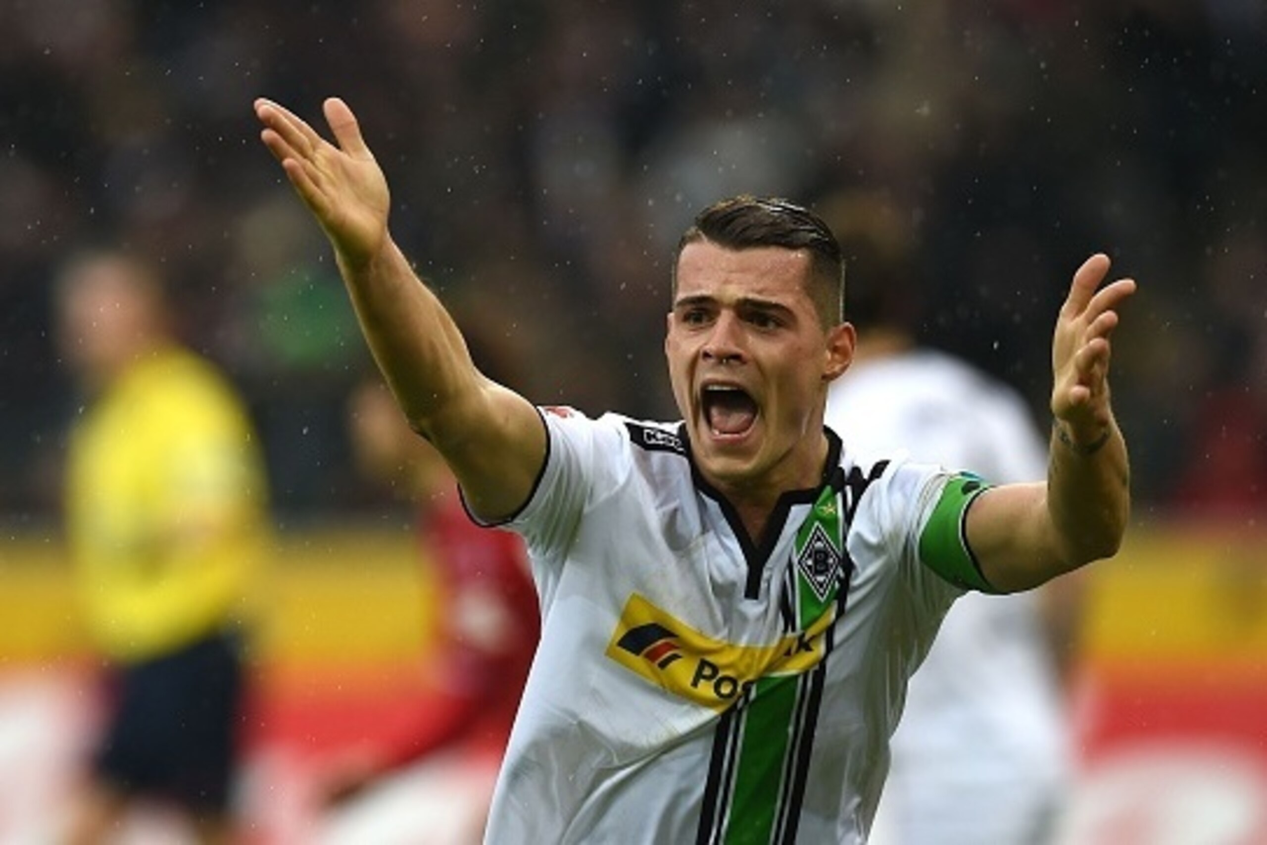 Moenchengladbach's Swiss midfielder Granit Xhaka reacts during the German first division Bundesliga football match Borussia Moenchengladbach vs 1. FC Cologne in Moenchengladbach , western Germany, on February  20, 2016. / AFP / PATRIK STOLLARZ / RESTRICTI