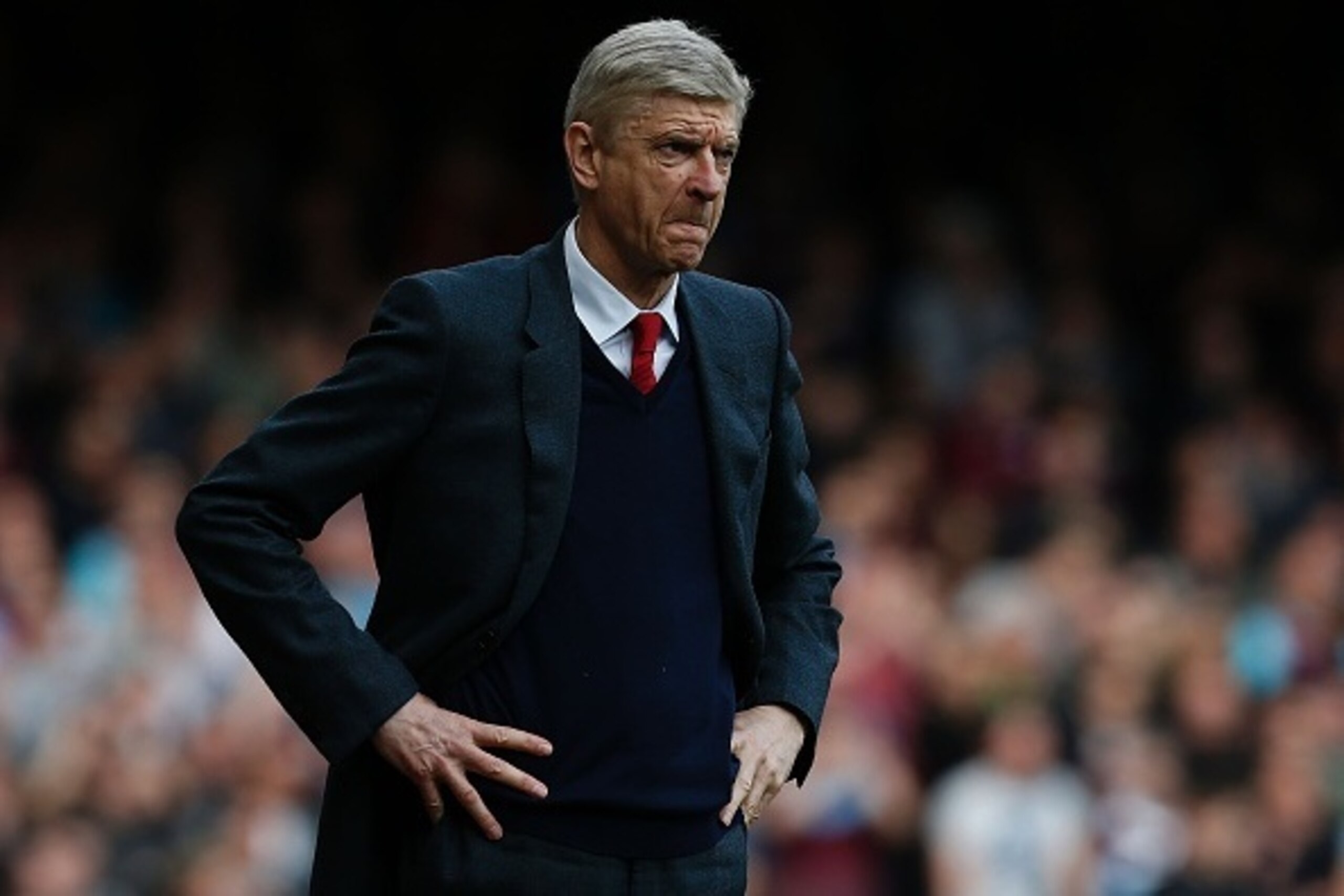 Arsenal's French manager Arsene Wenger reacts during the English Premier League football match between West Ham United and Arsenal at The Boleyn Ground in Upton Park, in east London on April 9, 2016.
The match ended 3-3. / AFP / Ian Kington / RESTRICTED T