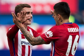 MADRID, SPAIN - APRIL 02: Antoine Griezmann (L) of Atletico de Madrid celebrates scoring their fourth goal with teammate Angel Martin Correa (R) during the La Liga match between Club Atletico de Madrid and Real Betis Balompie at Vicente Calderon Stadium o