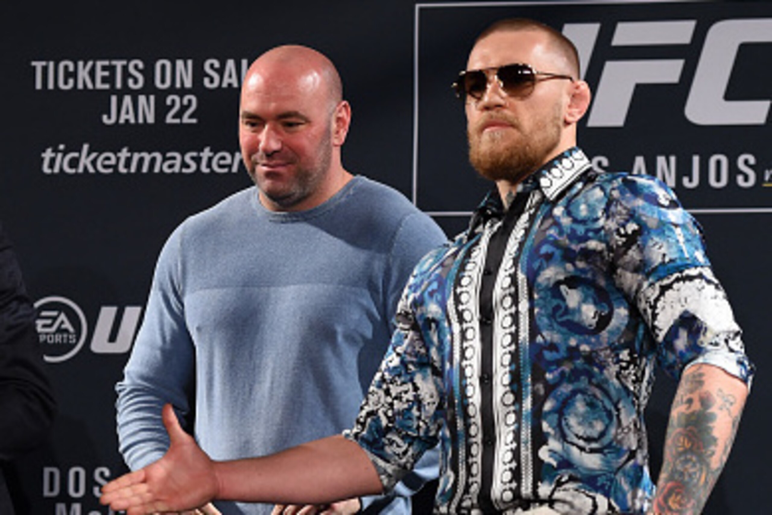 LAS VEGAS, NV - JANUARY 20:  UFC President Dana White squares off Rafael dos Anjos of Brazil (L) and Conor McGregor of Ireland (R) during the UFC 197 on-sale press conference event inside MGM Grand Hotel & Casino on January 20, 2016 in Las Vegas, Nevada. 