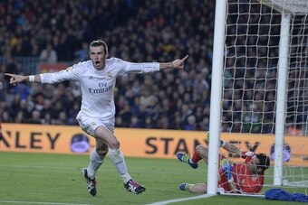 Real Madrid's Welsh forward Gareth Bale celebrates his disallowed goal during the Spanish league 'Clasico' football match FC Barcelona vs Real Madrid CF at the Camp Nou stadium in Barcelona on April 2, 2016. / AFP / JOSEP LAGO        (Photo credit should 