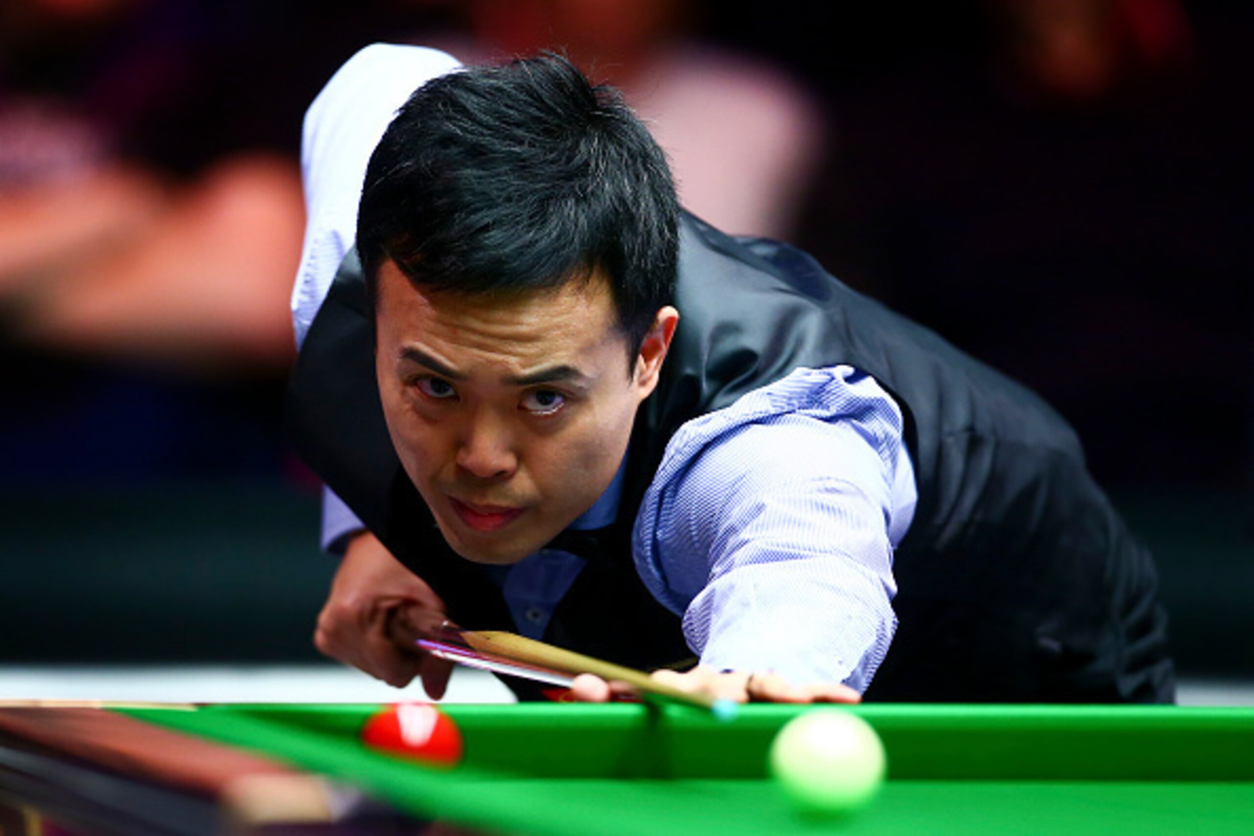 LONDON, ENGLAND - JANUARY 13:  Marco Fu of Hong Kong plays a shot in his first round match against Neil Robertson of Australia during Day Four of the Dafabet Masters at Alexandra Palace on January 13, 2016 in London, England.  (Photo by Jordan Mansfield/G