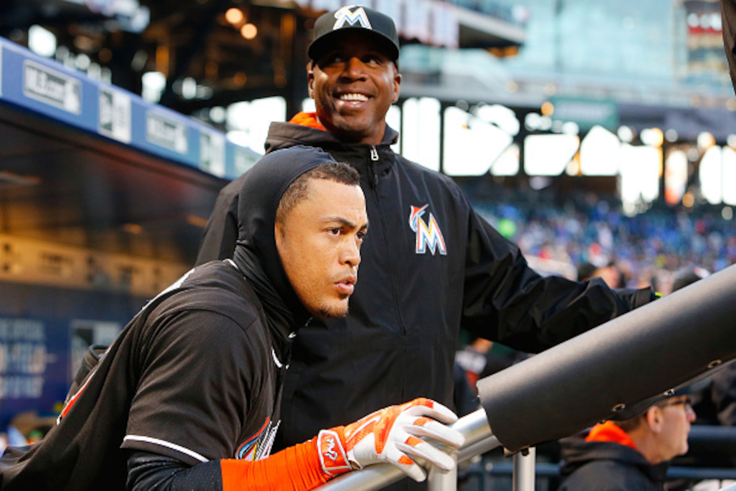 NEW YORK, NY - APRIL 12:  Giancarlo Stanton #27 and hitting coach Barry Bonds #25 of the Miami Marlins look on against the New York Mets at Citi Field on April 12, 2016 in the Flushing neighborhood of the Queens borough of New York City. The Marlins defea