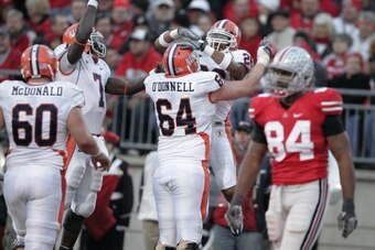 COLUMBUS, OH - NOVEMBER 10:  Brian Gamble #26 of Illinois celebrates with teammate Martin O'Donnell #64 after catching a touchdown pass at the end of the second quarter against Ohio State as Ohio State player Doug Worthington #84 walks to the sideline in 