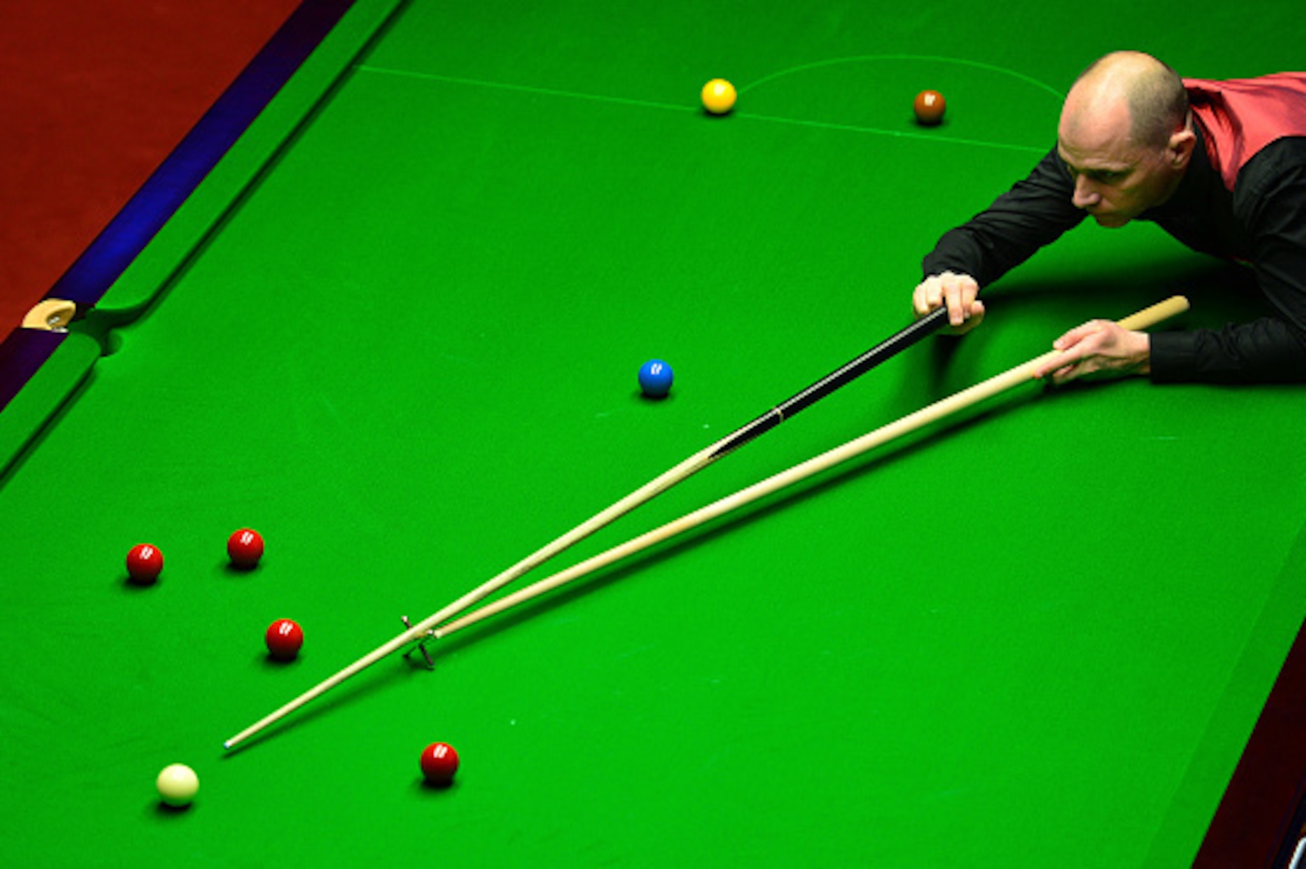 SHEFFIELD, ENGLAND - APRIL 21:  Joe Perry of England plays a shot during his first round match against Kyren Wilson of England on day six of the World Snooker Championship at The Crucible Theatre on April 21, 2016 in Sheffield, England.  (Photo by Dan Mul