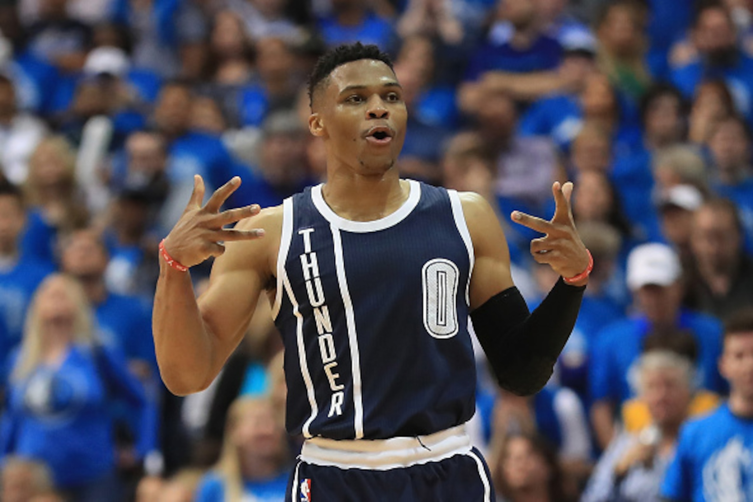 DALLAS, TX - APRIL 21:  Russell Westbrook #0 of the Oklahoma City Thunder reacts after making a three-point shot against the Dallas Mavericks during game three of the Western Conference Quarterfinals of the 2016 NBA Playoffs at American Airlines Center on
