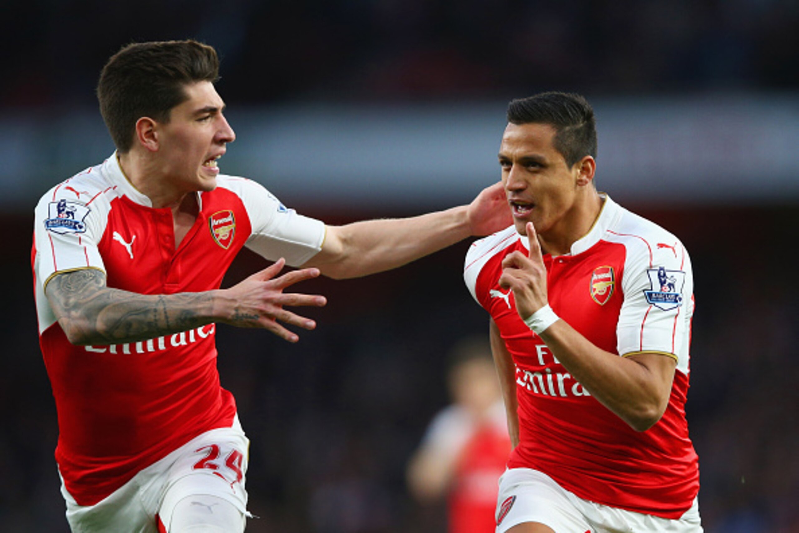LONDON, ENGLAND - APRIL 21:  Alexis Sanchez of Arsenal (R) celebrates with Hector Bellerin as he scores their first goal during the Barclays Premier League match between Arsenal and West Bromwich Albion at the Emirates Stadium on April 21, 2016 in London,