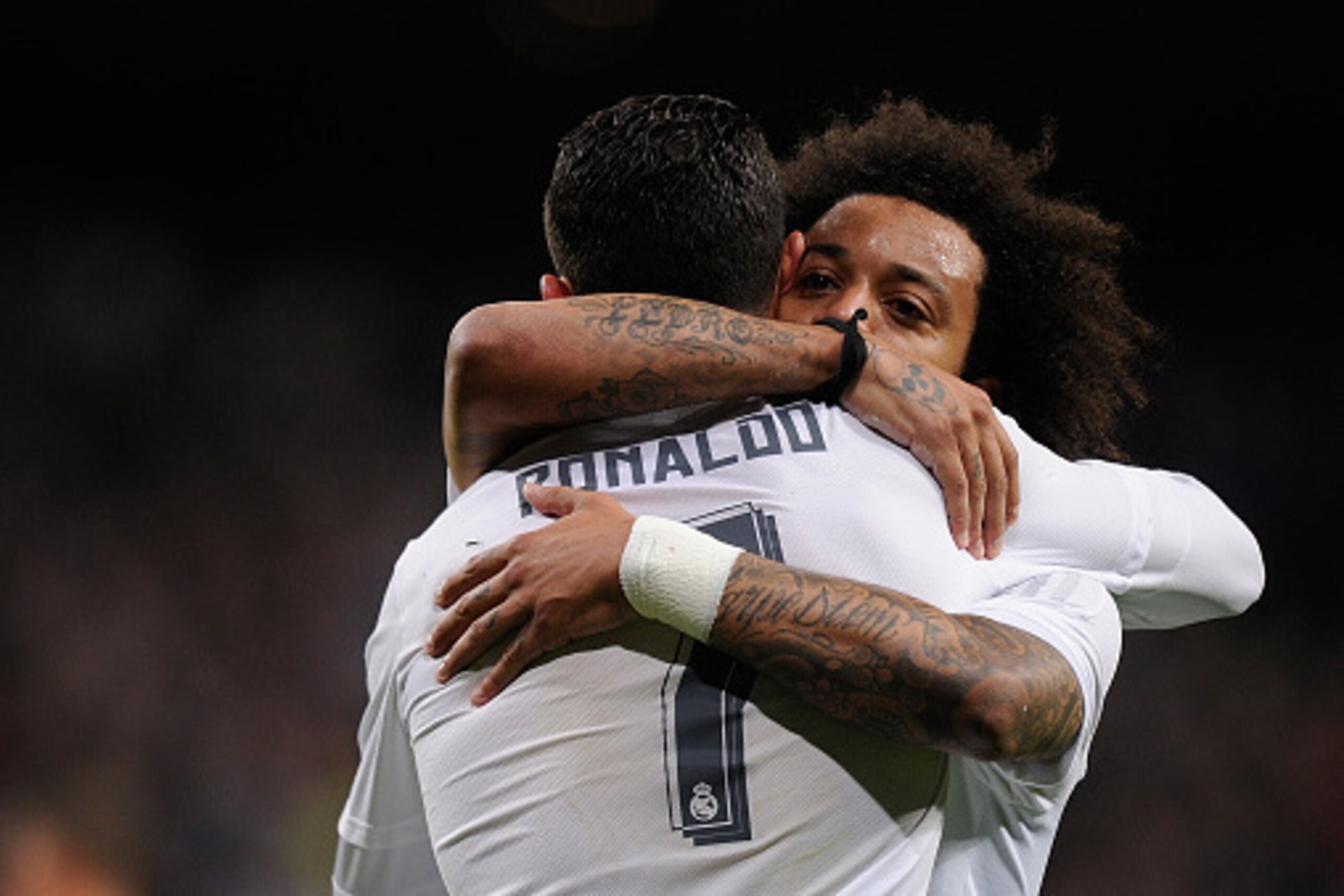 MADRID, SPAIN - APRIL 20:  Cristiano Ronaldo of Real Madrid celebrates with Marcelo after Real scored their opening goal during the La Liga match between Real Madrid and Villarreal at Estadio Santiago Bernabeu on April 20, 2016 in Madrid, Spain.  (Photo b