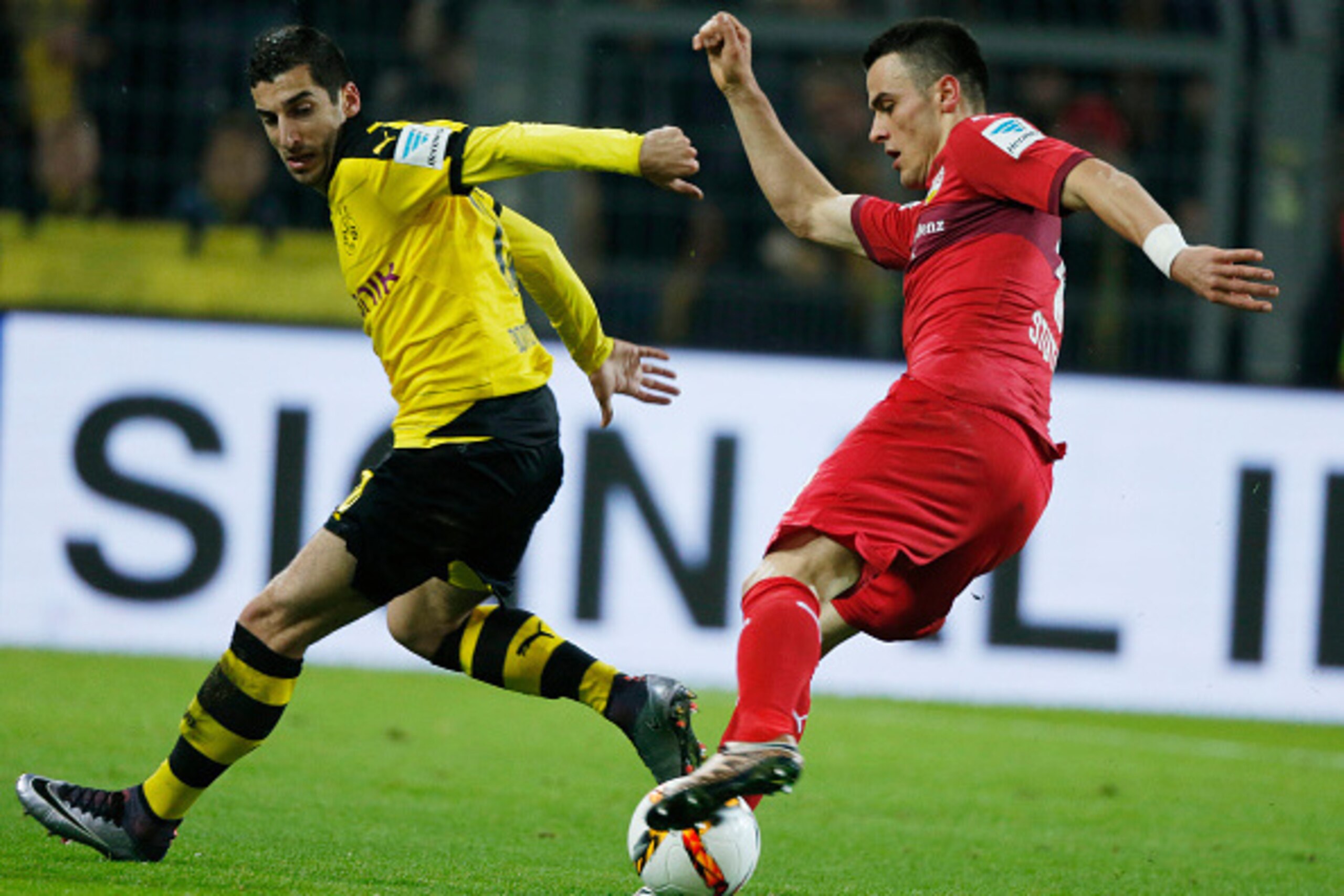 Dortmund's Armenian midfielder Henrikh Mkhitaryan (L) and Stuttgart's Serbian midfielder Filip Kostic vie for the ball during the German first division Bundesliga football match Borussia Dortmund vs VfB Stuttgart, in Dortmund, western Germany, on November Dortmund's Armenian midfielder Henrikh Mkhitaryan (L) and Stuttgart's Serbian midfielder Filip Kostic vie for the ball during the German first division Bundesliga football match Borussia Dortmund vs VfB Stuttgart, in Dortmund, western Germany, on November