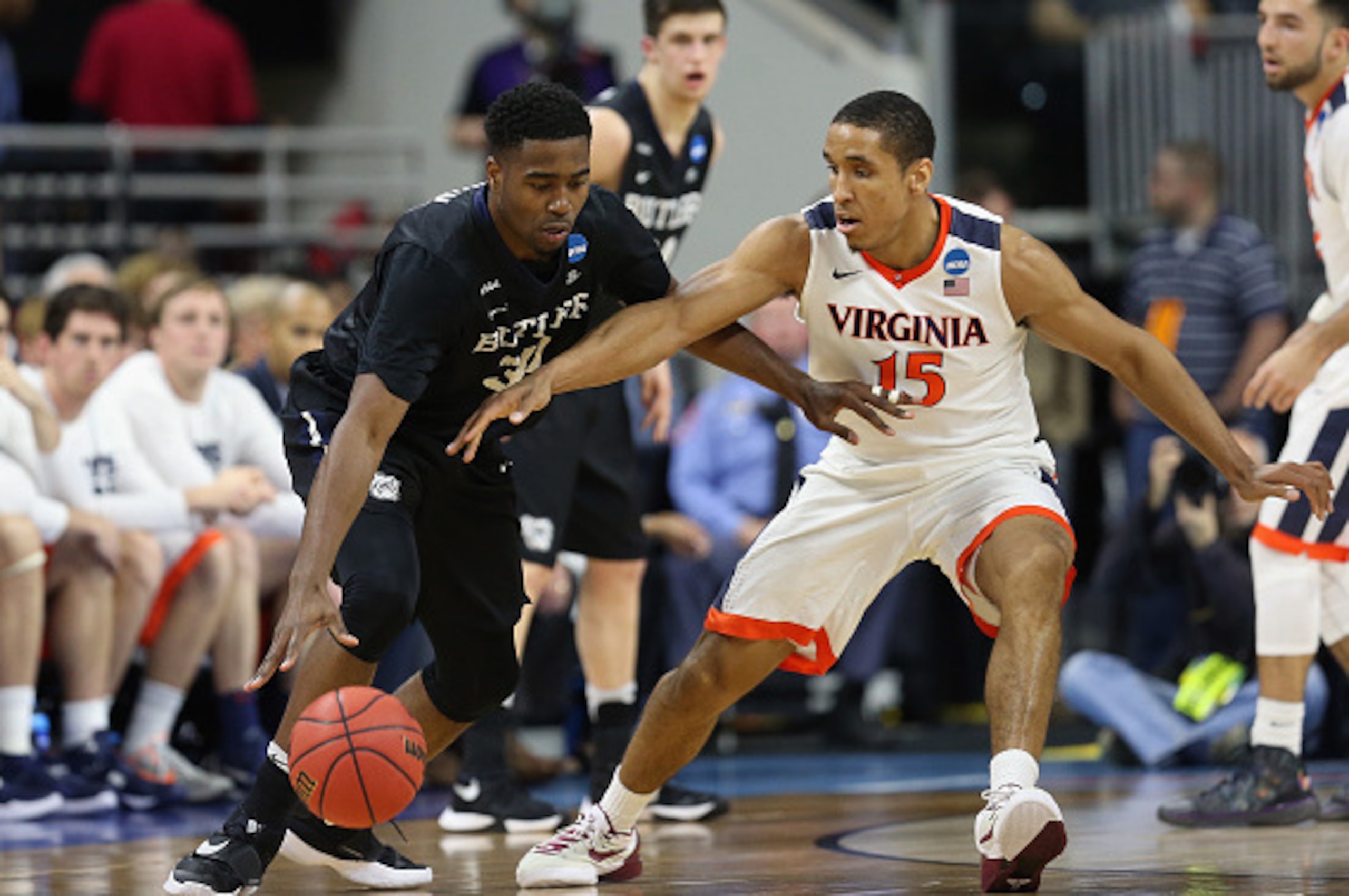 RALEIGH, NC - MARCH 19:  Kelan Martin #30 of the Butler Bulldogs drives against Malcolm Brogdon #15 of the Virginia Cavaliers in the first half during the second round of the 2016 NCAA Men's Basketball Tournament at PNC Arena on March 19, 2016 in Raleigh,