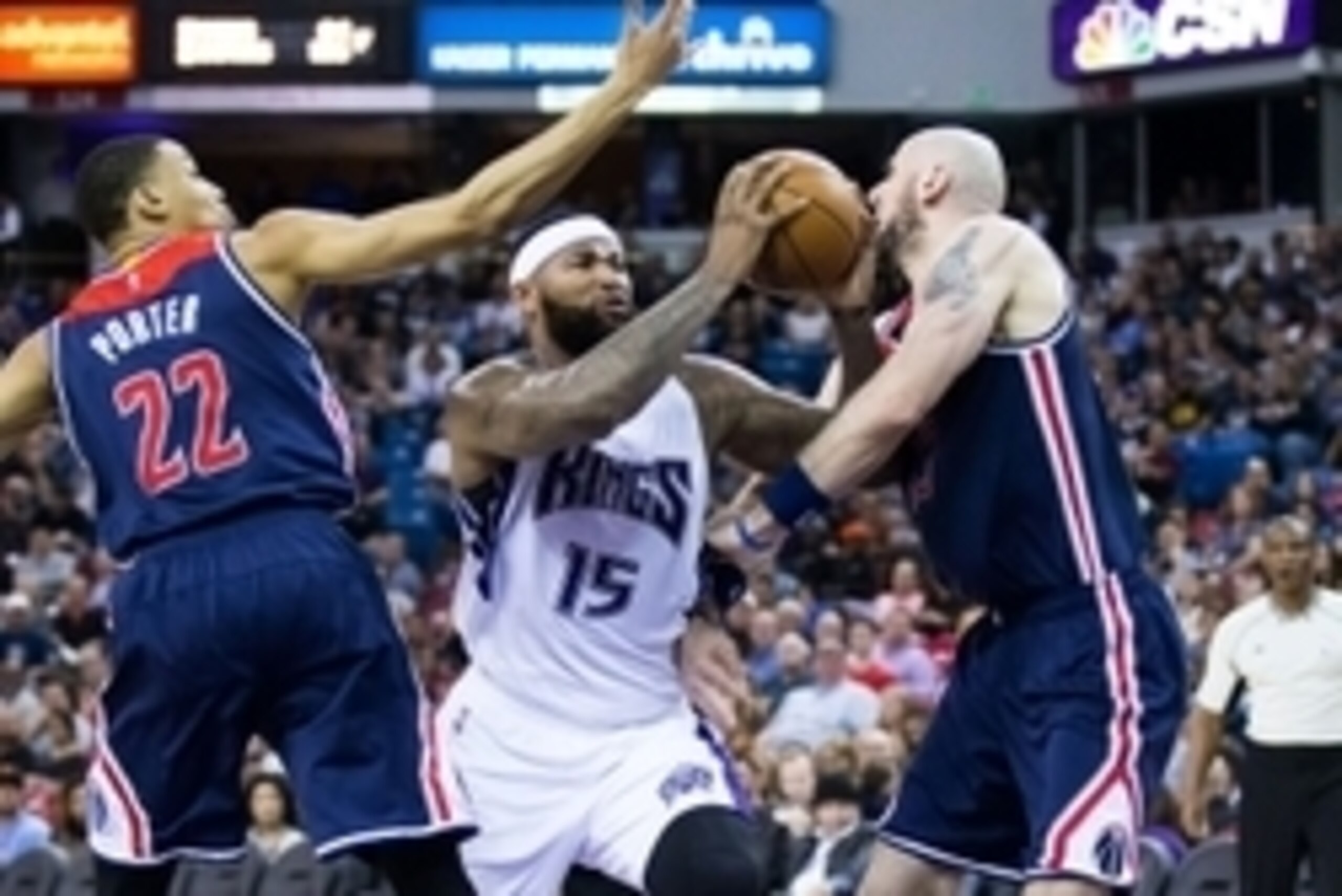 Mar 30, 2016; Sacramento, CA, USA; Sacramento Kings center DeMarcus Cousins (15) drives in between Washington Wizards forward Otto Porter Jr. (22) and center Marcin Gortat (13) during the third quarter at Sleep Train Arena. The Sacramento Kings defeated t Mar 30, 2016; Sacramento, CA, USA; Sacramento Kings center DeMarcus Cousins (15) drives in between Washington Wizards forward Otto Porter Jr. (22) and center Marcin Gortat (13) during the third quarter at Sleep Train Arena. The Sacramento Kings defeated t