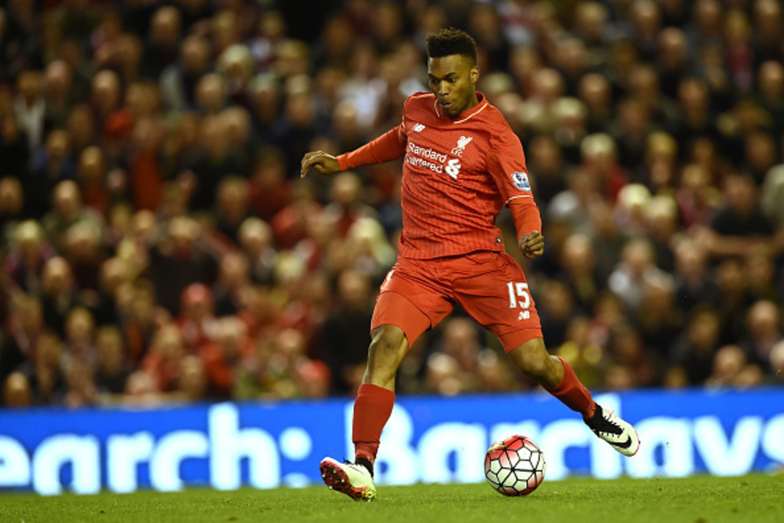 Liverpool's English striker Daniel Sturridge shoots and scores during the English Premier League football match between Liverpool and Everton at Anfield in Liverpool, north west England on April 20, 2016. / AFP / PAUL ELLIS / RESTRICTED TO EDITORIAL USE. 