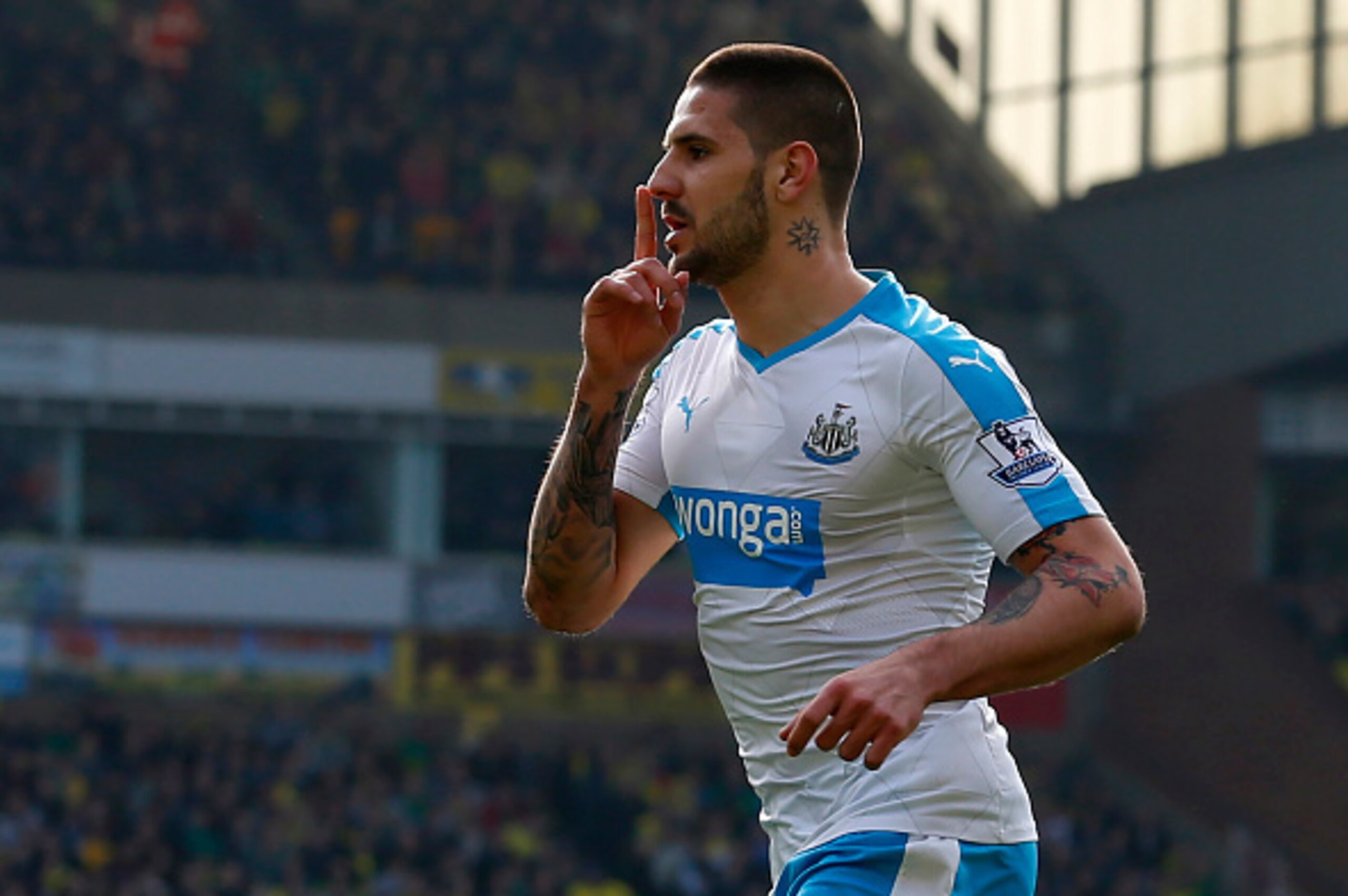 Newcastle Uniteds Serbian striker Aleksandar Mitrovic celebrates after scoring during the English Premier League football match between Norwich City and Newcastle United at Carrow Road in Norwich, eastern England, on April 2, 2016.

 / AFP / LINDSEY PARNA