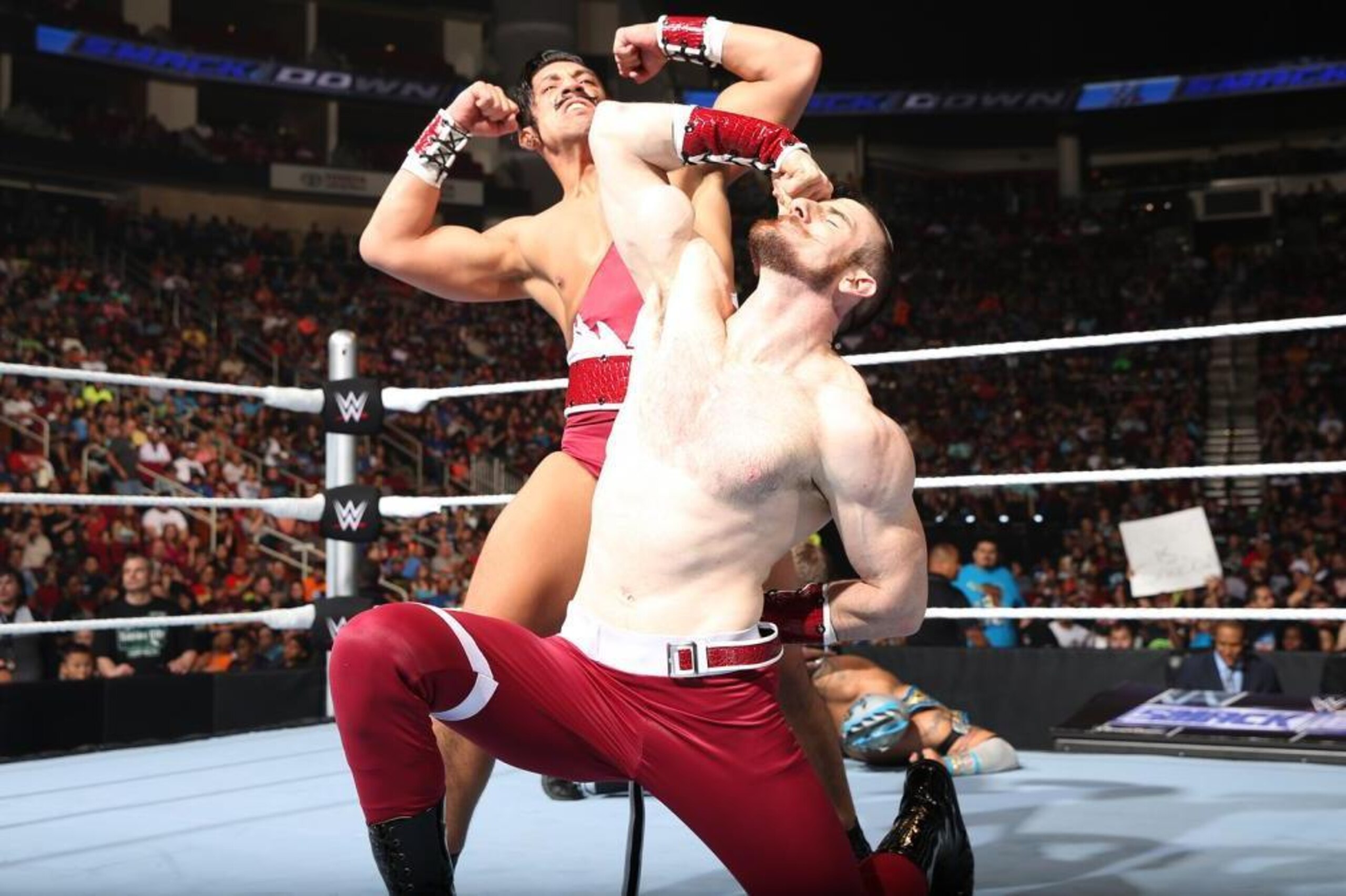 Simon Gotch and Aiden English pose after a win on SmackDown.