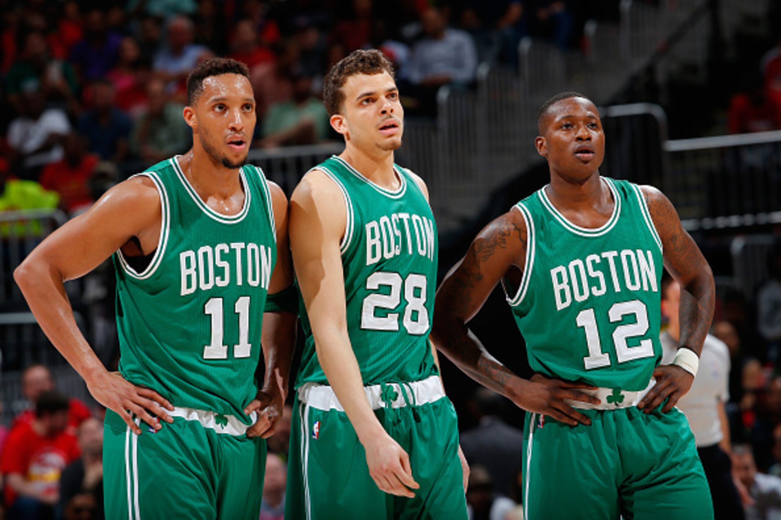 ATLANTA, GA - APRIL 19:  Evan Turner #11, R.J. Hunter #28 and Terry Rozier #12 of the Boston Celtics watch an Atlanta Hawks free throw after Rozier was called for a technical foul in Game Two of the Eastern Conference Quarterfinals during the 2016 NBA Pla